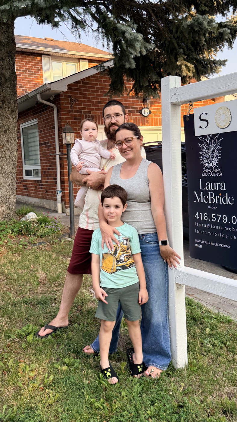 An Ajax family celebrating their move with Laura McBride, REALTOR&reg;
