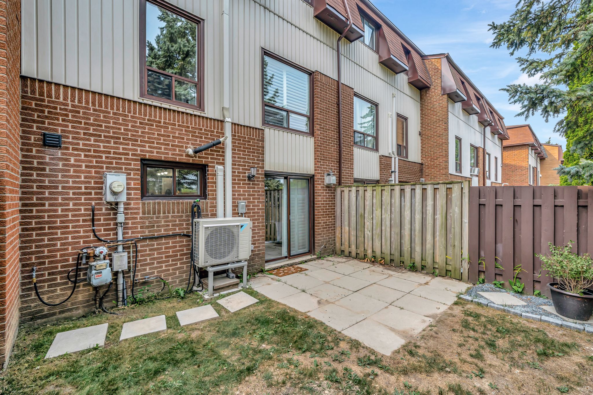 Private fenced backyard at 10-765 Oklahoma Dr, Pickering, with a patio