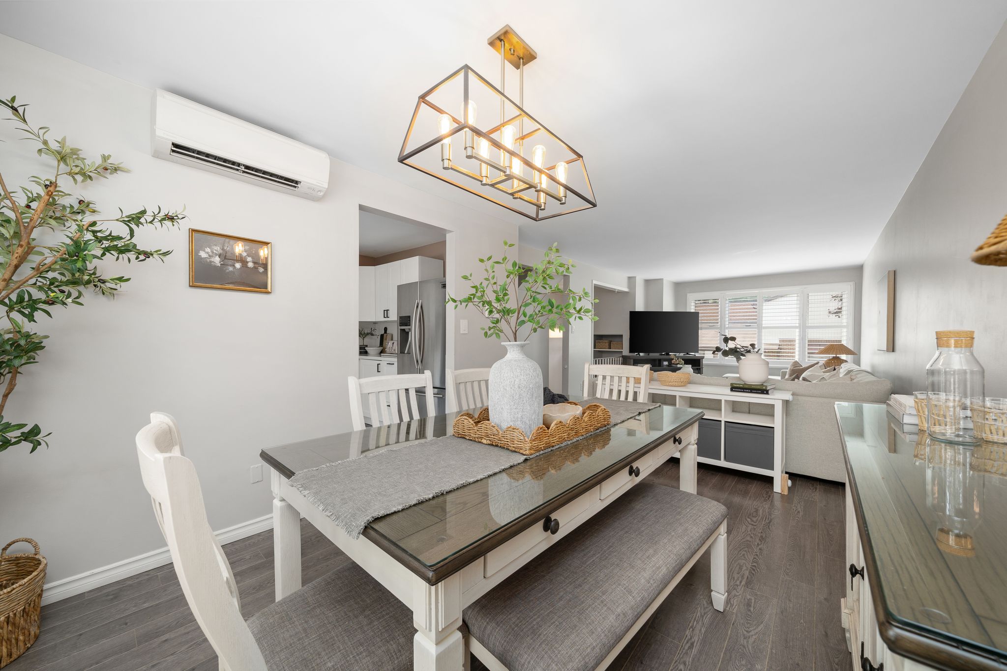 Dining room at 10-765 Oklahoma Dr, Pickering, open to the living room with California shutters