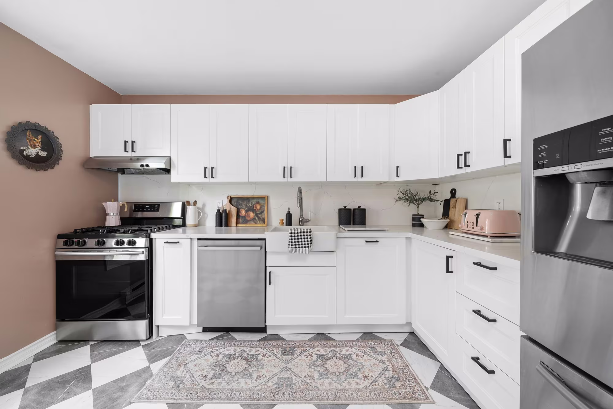 Renovated kitchen at 10-765 Oklahoma Dr, Pickering, with quartz counters and white cabinetry