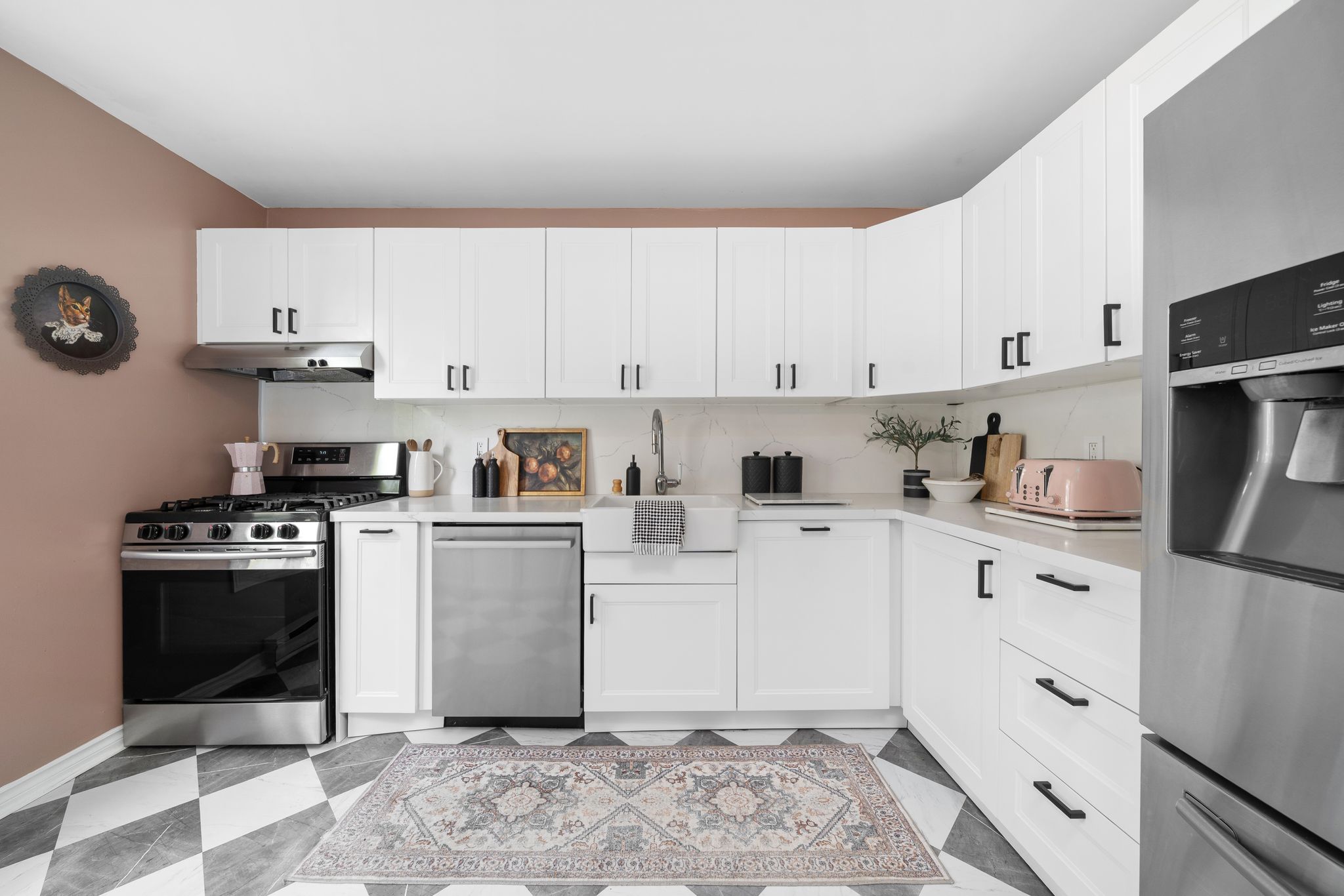 Renovated kitchen at 10-765 Oklahoma Dr, Pickering, with quartz counters and white cabinetry