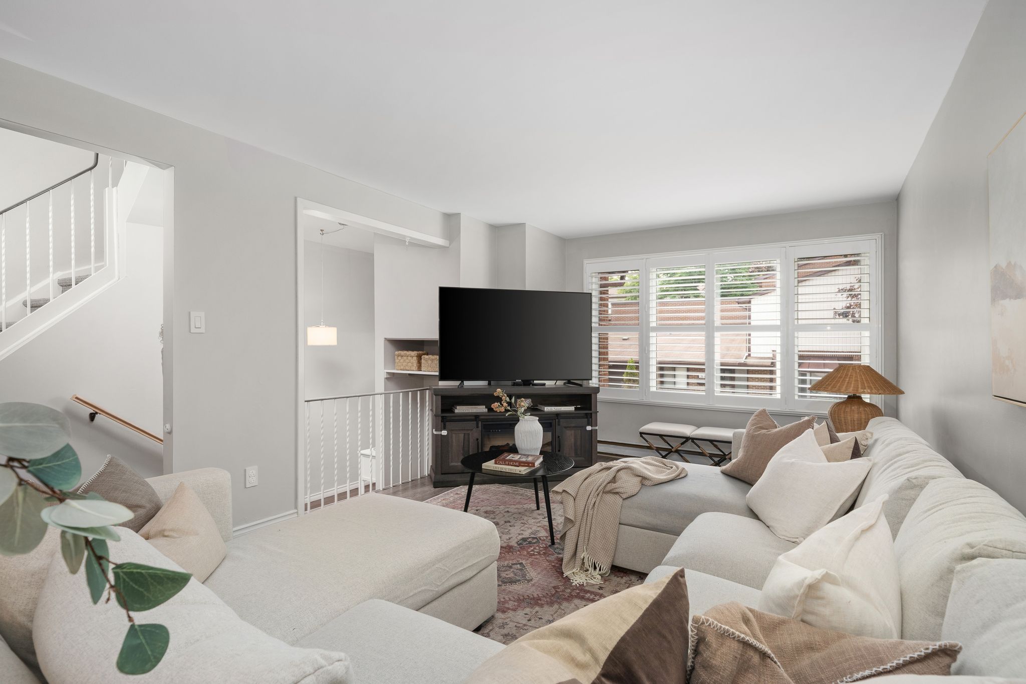 Living room at 10-765 Oklahoma Dr, Pickering, with smooth ceilings and wide plank flooring
