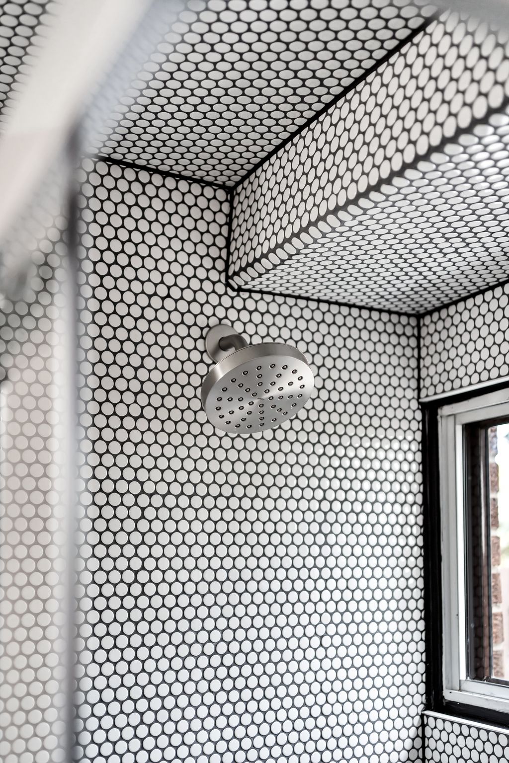 Herringbone tile shower detail in the ground-level bathroom at 10-765 Oklahoma Dr, Pickering