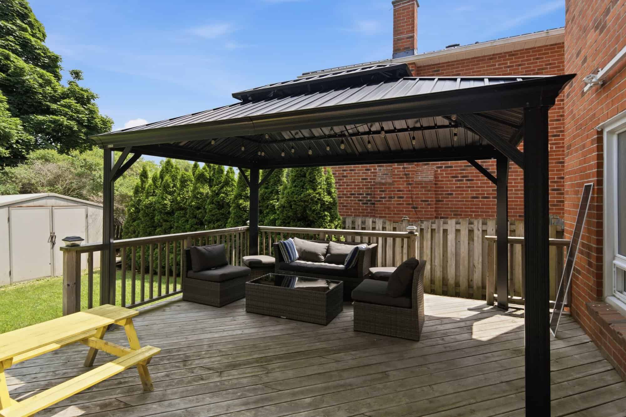 Covered gazebo in the backyard at 13 Flowers Crescent, South Ajax, with lighting