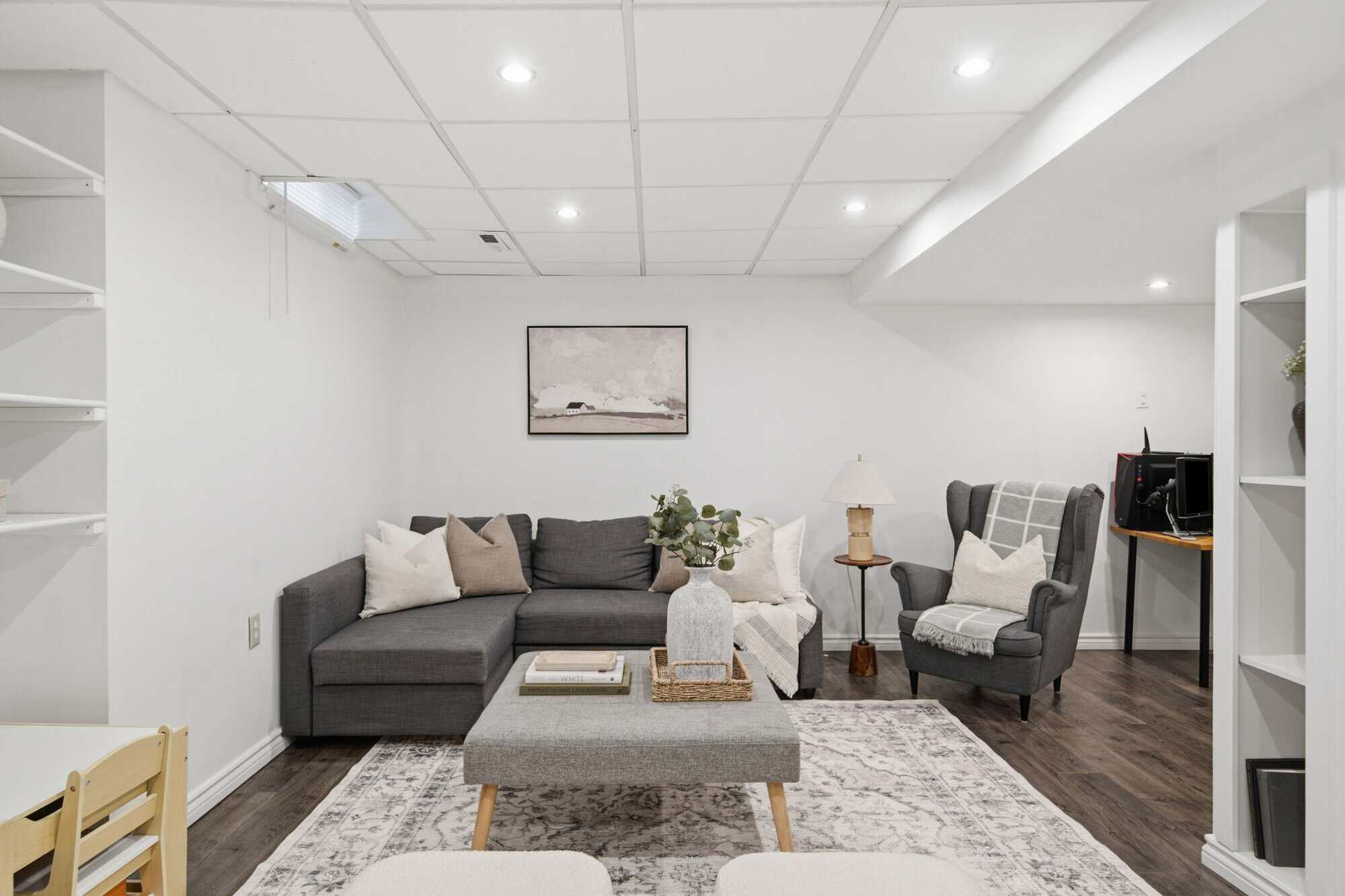 Finished basement recreation room at 13 Flowers Crescent, South Ajax, open concept with room for a home office