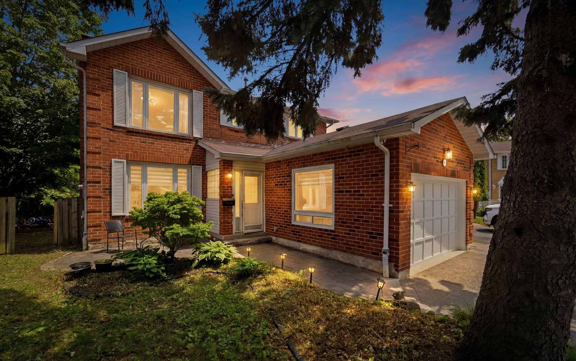 Twilight exterior of 13 Flowers Crescent, a detached home in South Ajax, Ontario, listed by Laura McBride, Ajax REALTOR® with Revel Realty