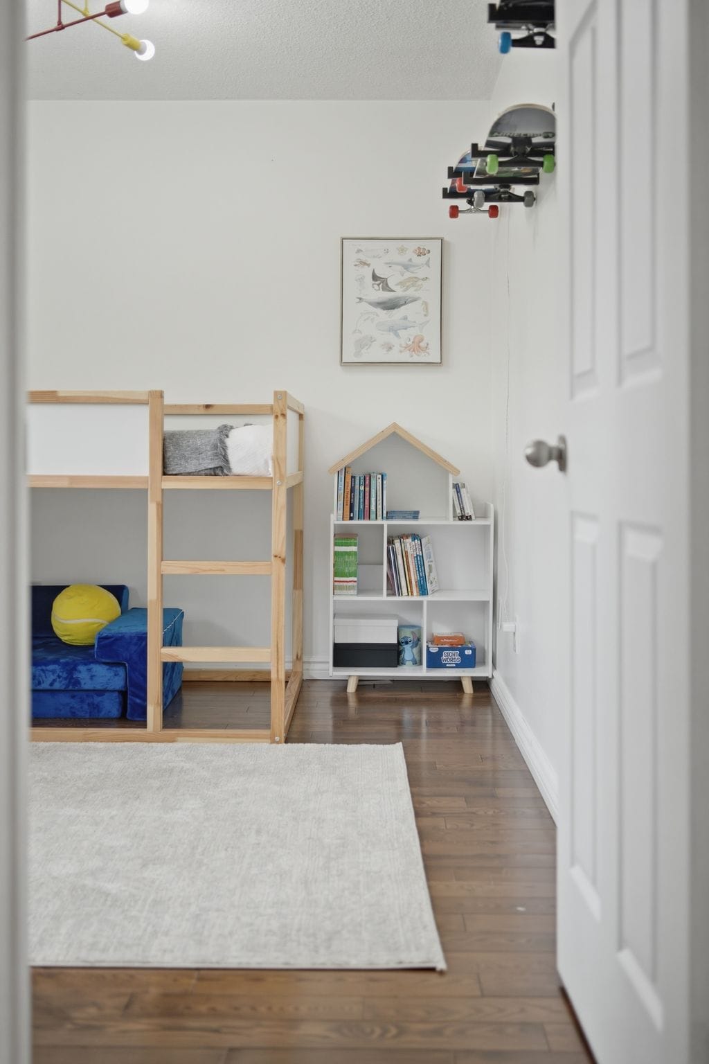 Second bedroom at 13 Flowers Crescent, South Ajax, styled with a loft bed, play sofa and bookshelf