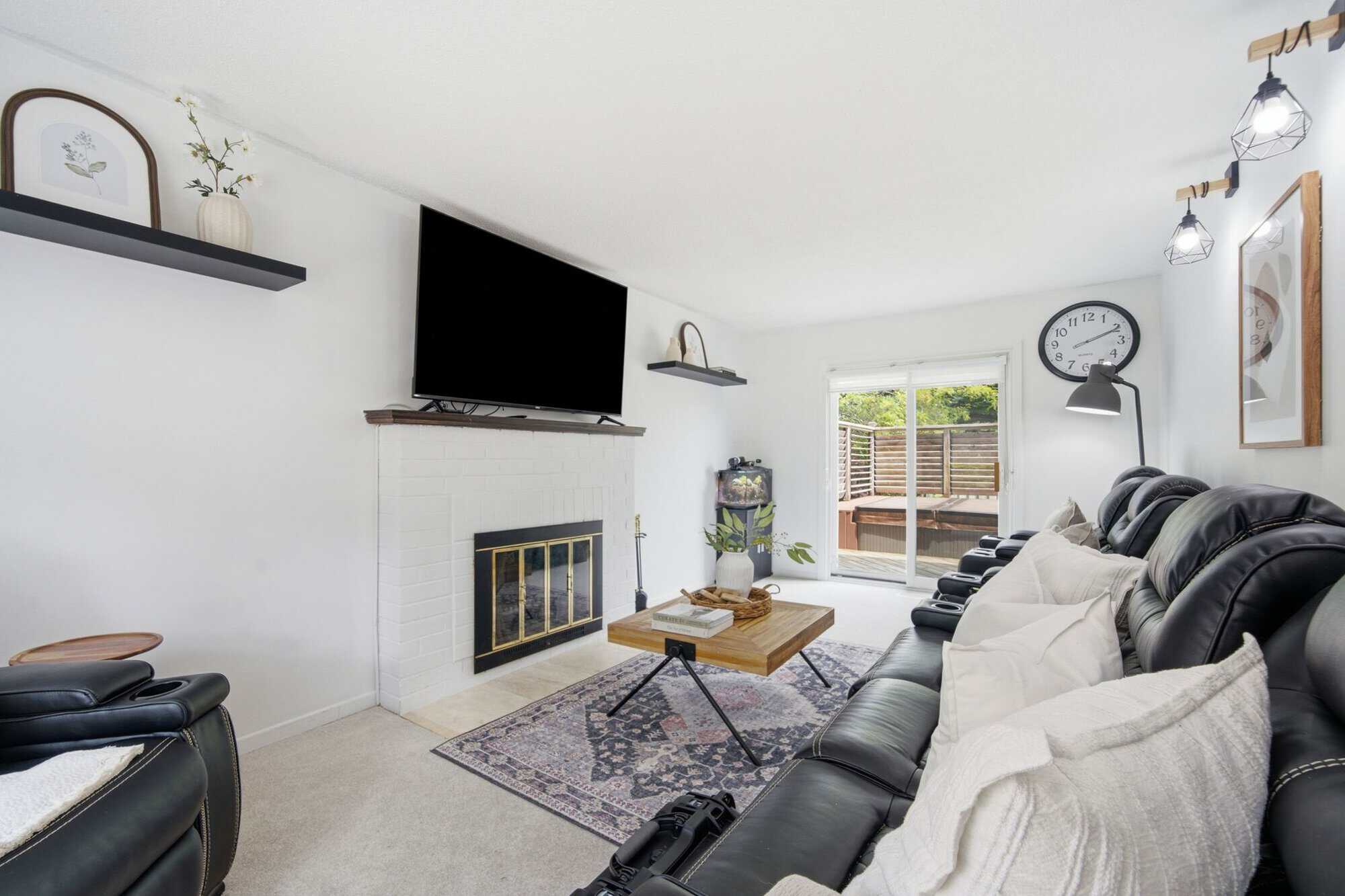 Living room at 13 Flowers Crescent, South Ajax, with hardwood floors, a fireplace and east/west exposure for natural light