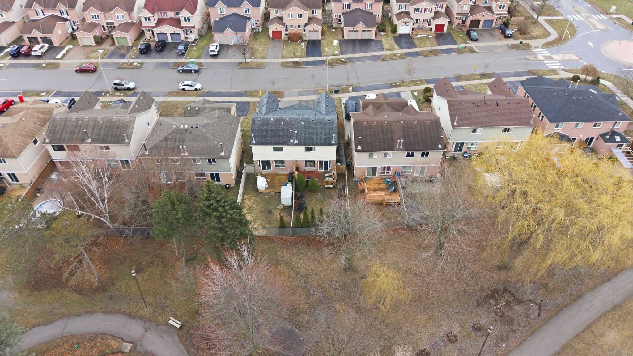 Aerial view of 13 Rollo Drive, South East Ajax, showing the home backing onto park and greenspace
