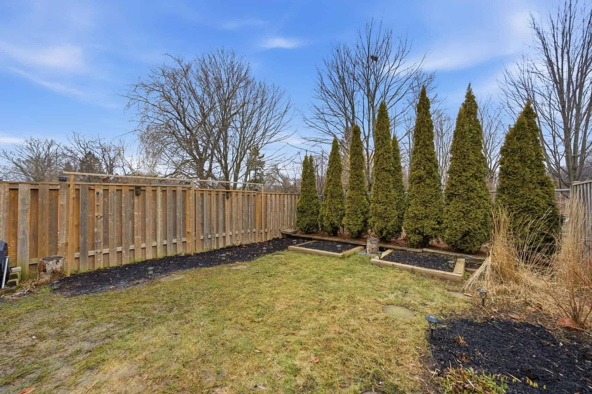 Backyard at 13 Rollo Drive, South East Ajax, with a deck and no rear neighbours