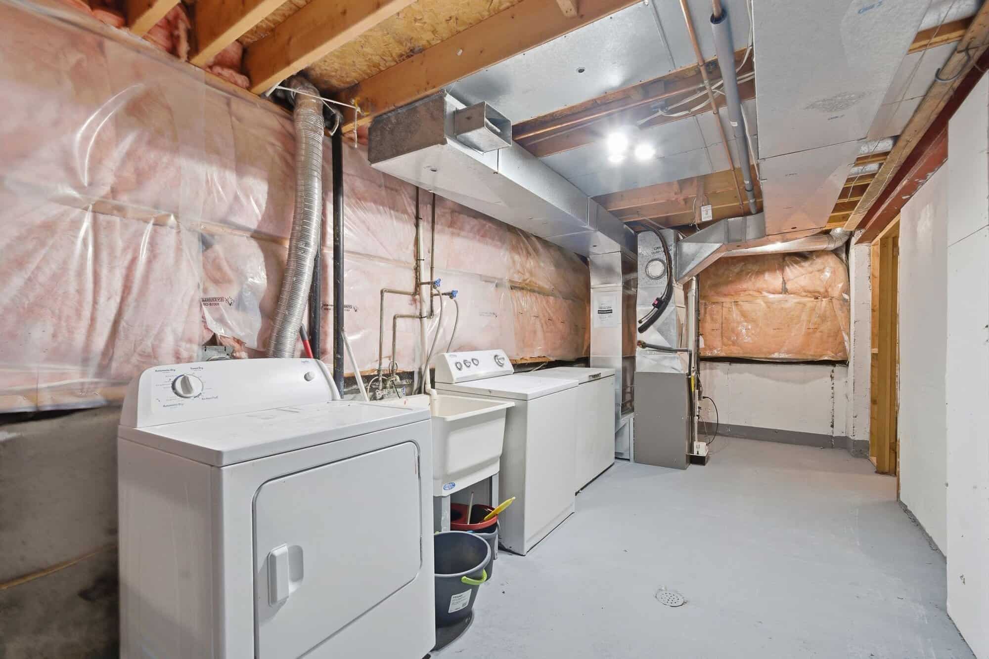 Basement laundry area at 13 Rollo Drive, South East Ajax
