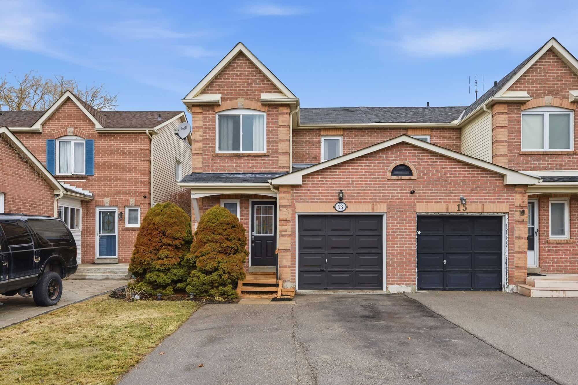 Front exterior of 13 Rollo Drive, South East Ajax, a semi-detached home, listed by Laura McBride, Ajax REALTOR®