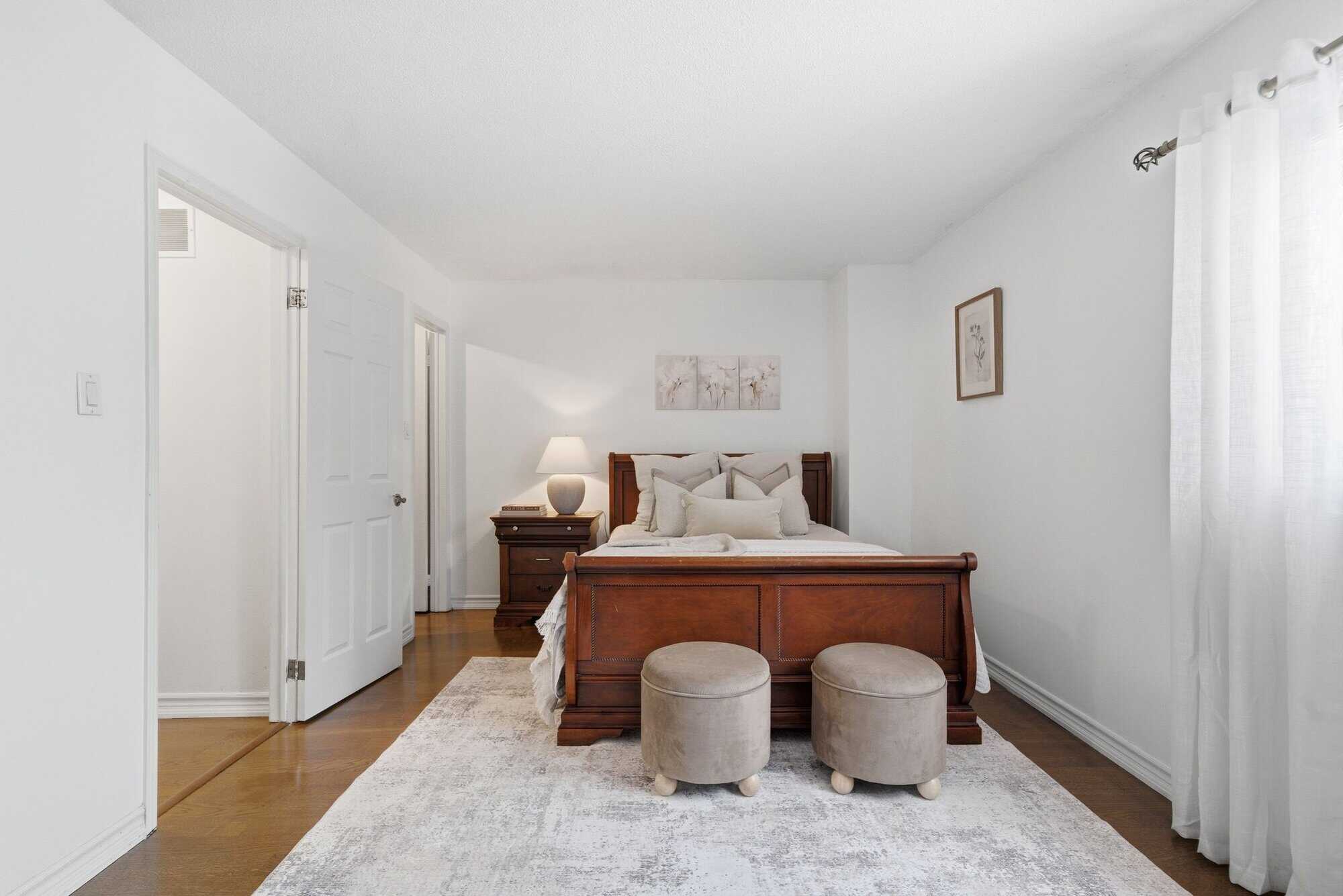 Primary bedroom at 13 Rollo Drive, South East Ajax, a large bright room with a walk-in closet