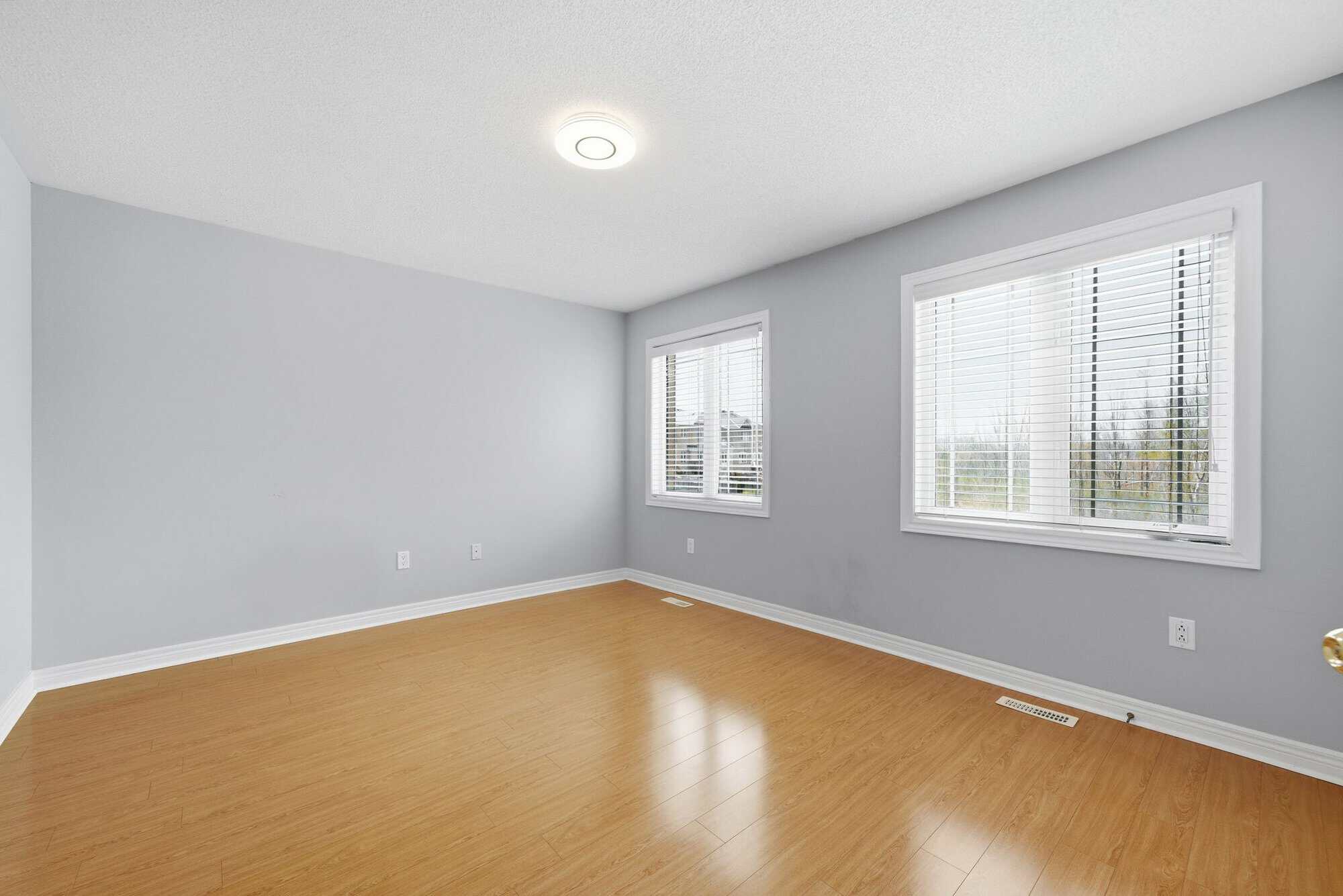 Fourth bedroom at 131 Rushworth Drive, Ajax, with double closet and natural light