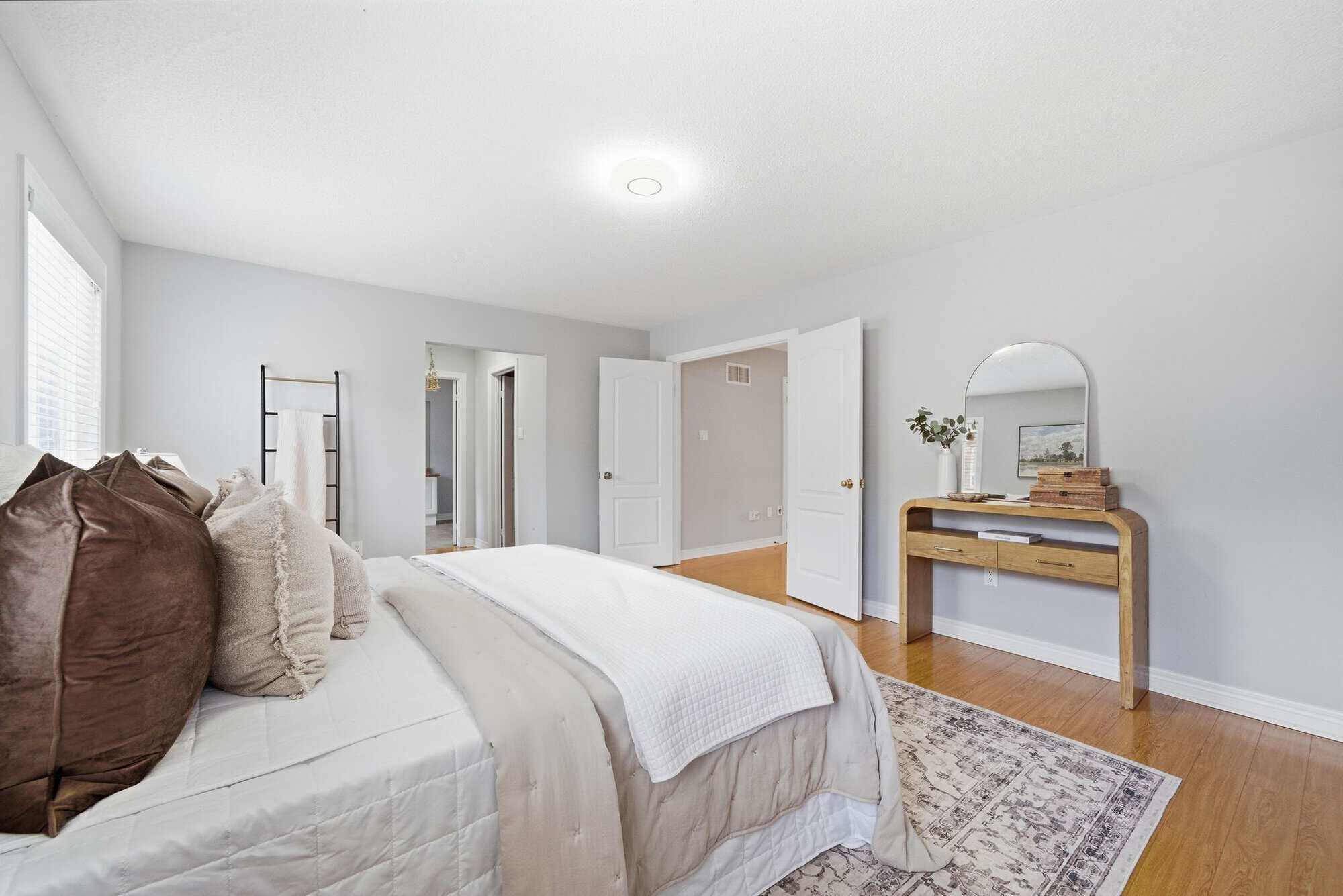 Primary bedroom at 131 Rushworth Drive, Ajax, oversized with room for a king bed and seating
