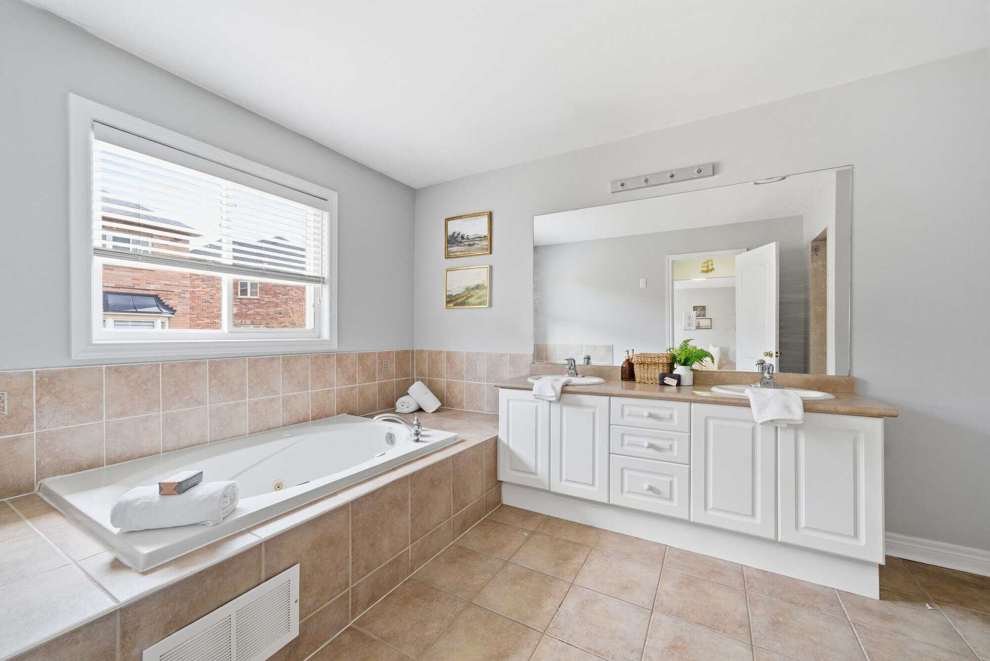 5-piece primary ensuite at 131 Rushworth Drive, Ajax, with a soaker tub and double vanity