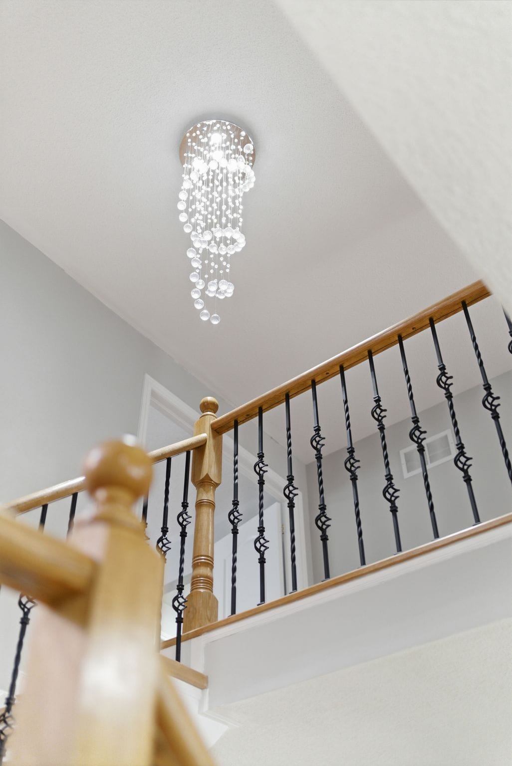 Cascading crystal bubble chandelier over the upper landing at 131 Rushworth Drive, Ajax