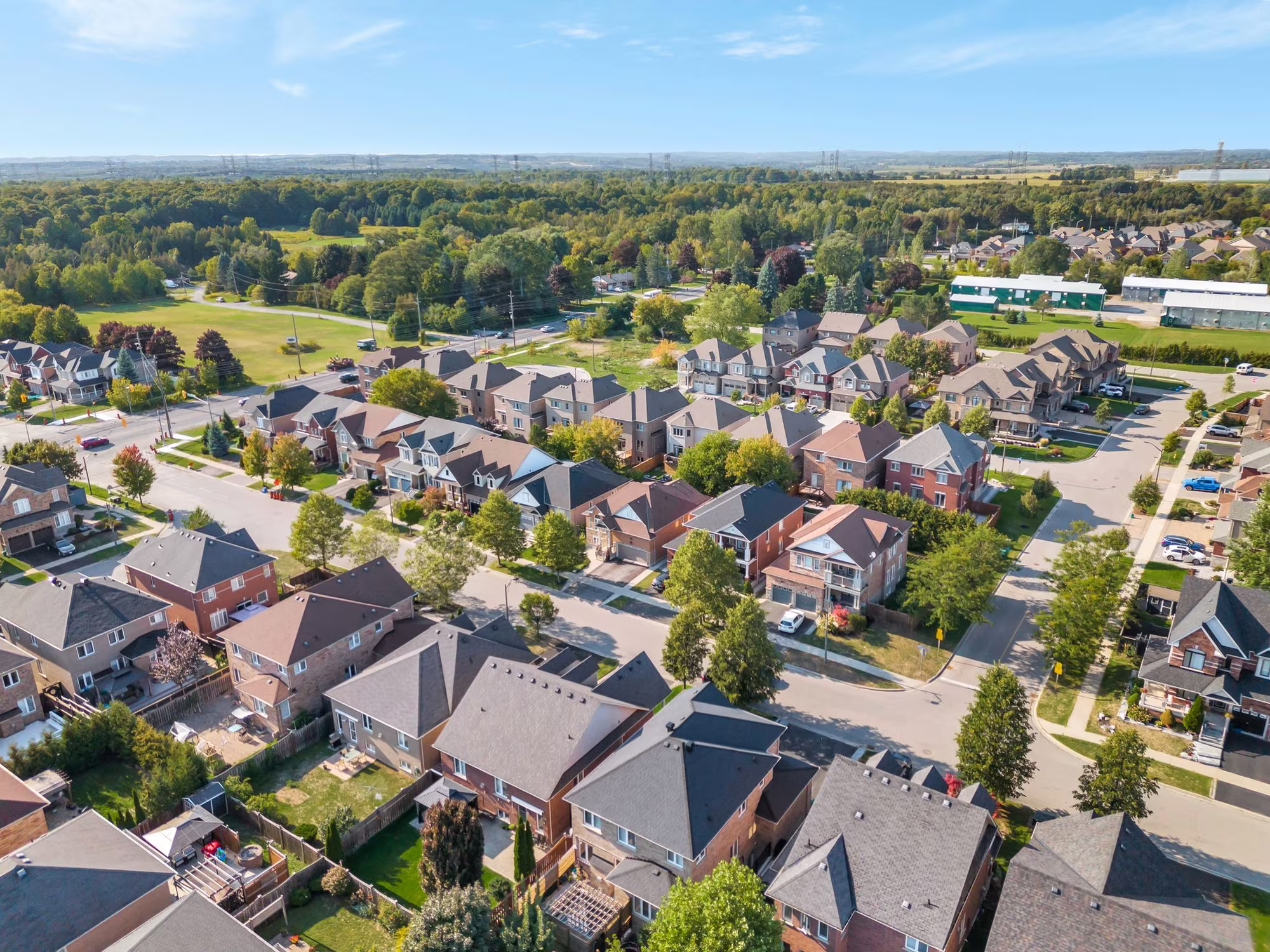 Aerial view of 14 Sleepy Hollow Place, Whitby, from the north west, showing the home, driveway and surrounding Taunton North streets