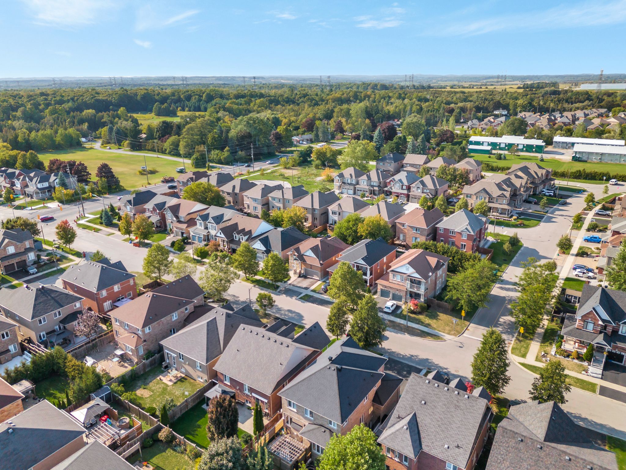 Aerial view of 14 Sleepy Hollow Place, Whitby, from the north west, showing the home, driveway and surrounding Taunton North streets