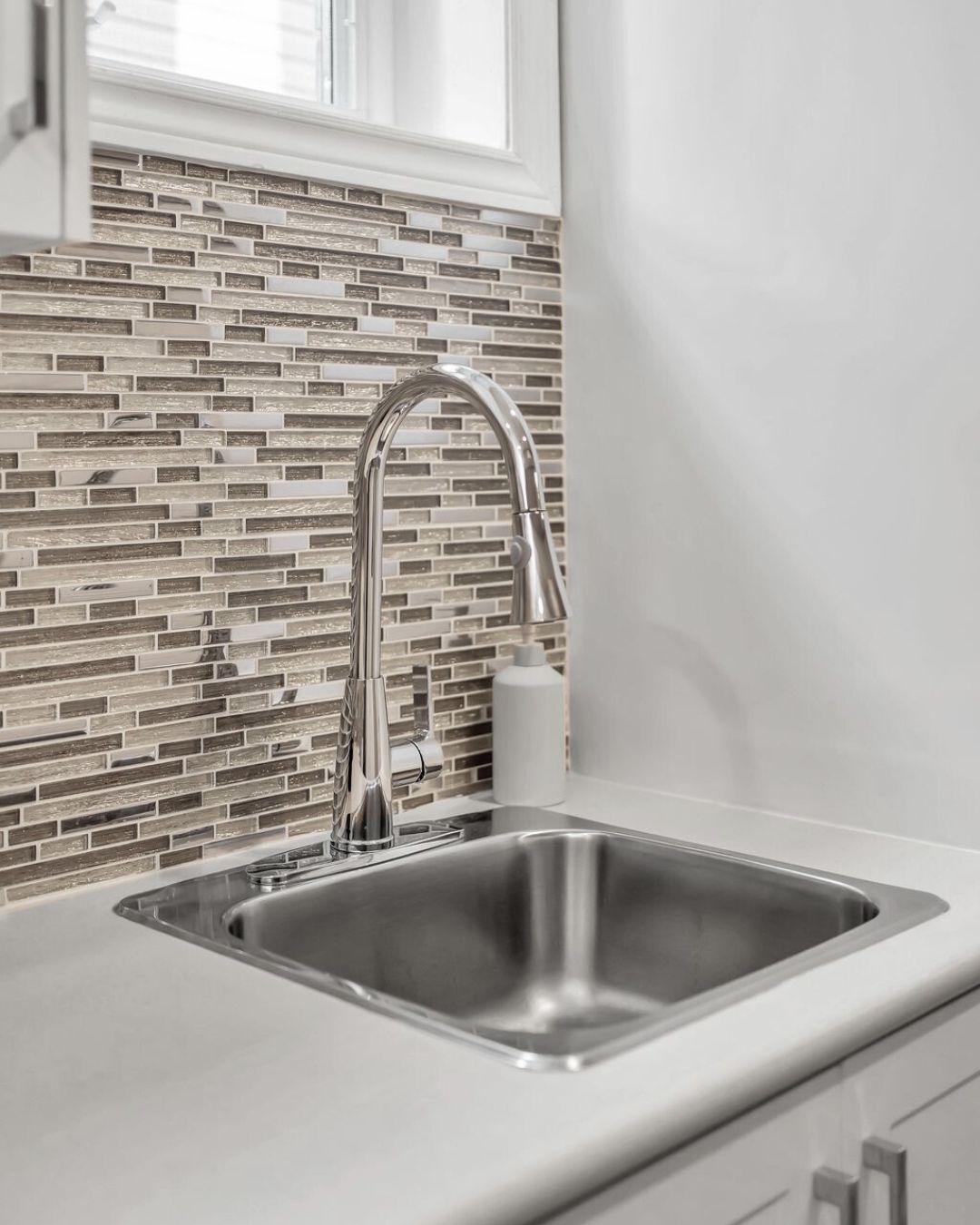 Basement kitchenette sink and backsplash detail at 14 Sleepy Hollow Place, Whitby
