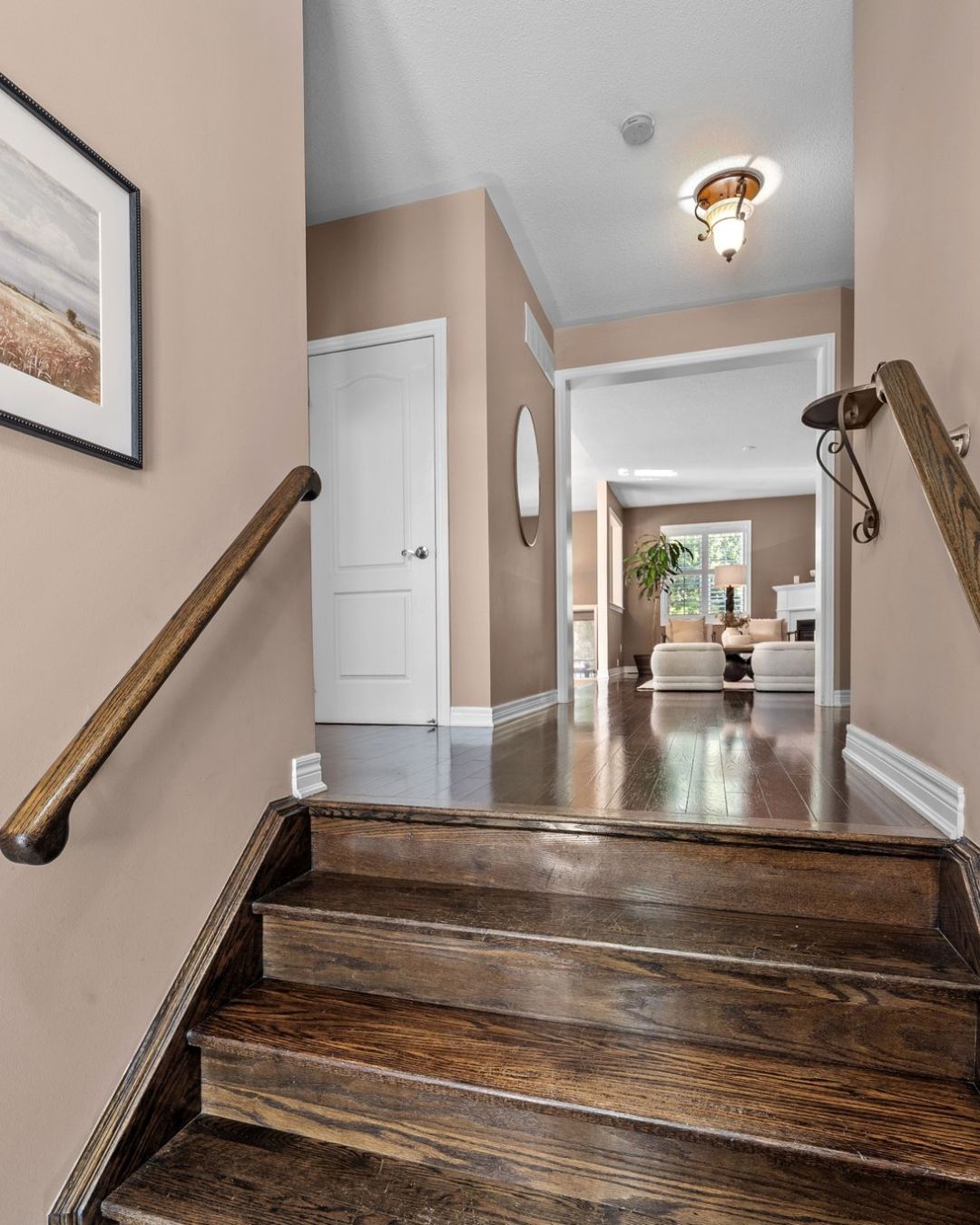 Front entry at 14 Sleepy Hollow Place, Whitby, with hardwood staircase to the finished basement
