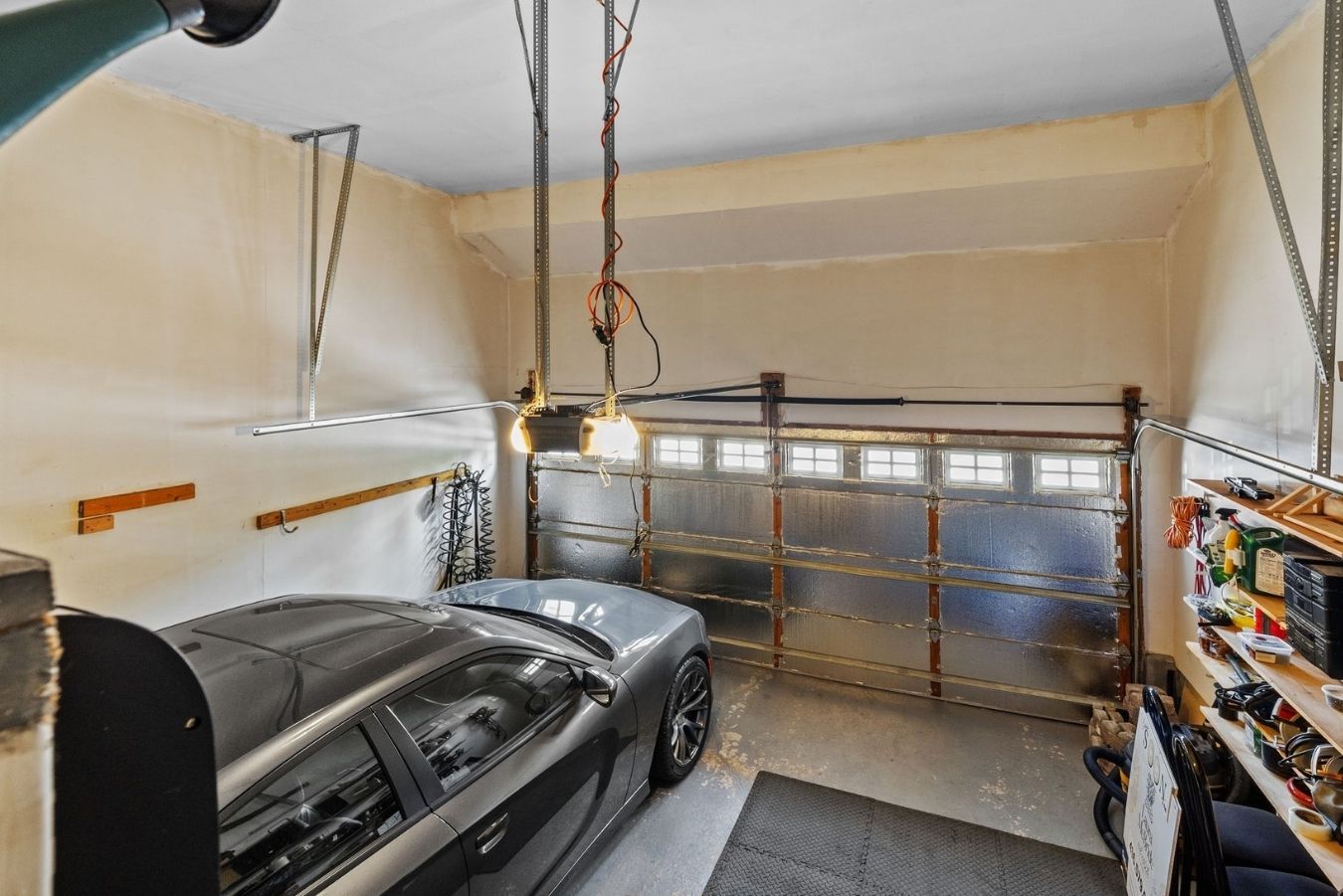 Built-in double garage at 14 Sleepy Hollow Place, Whitby, with built-in shelving