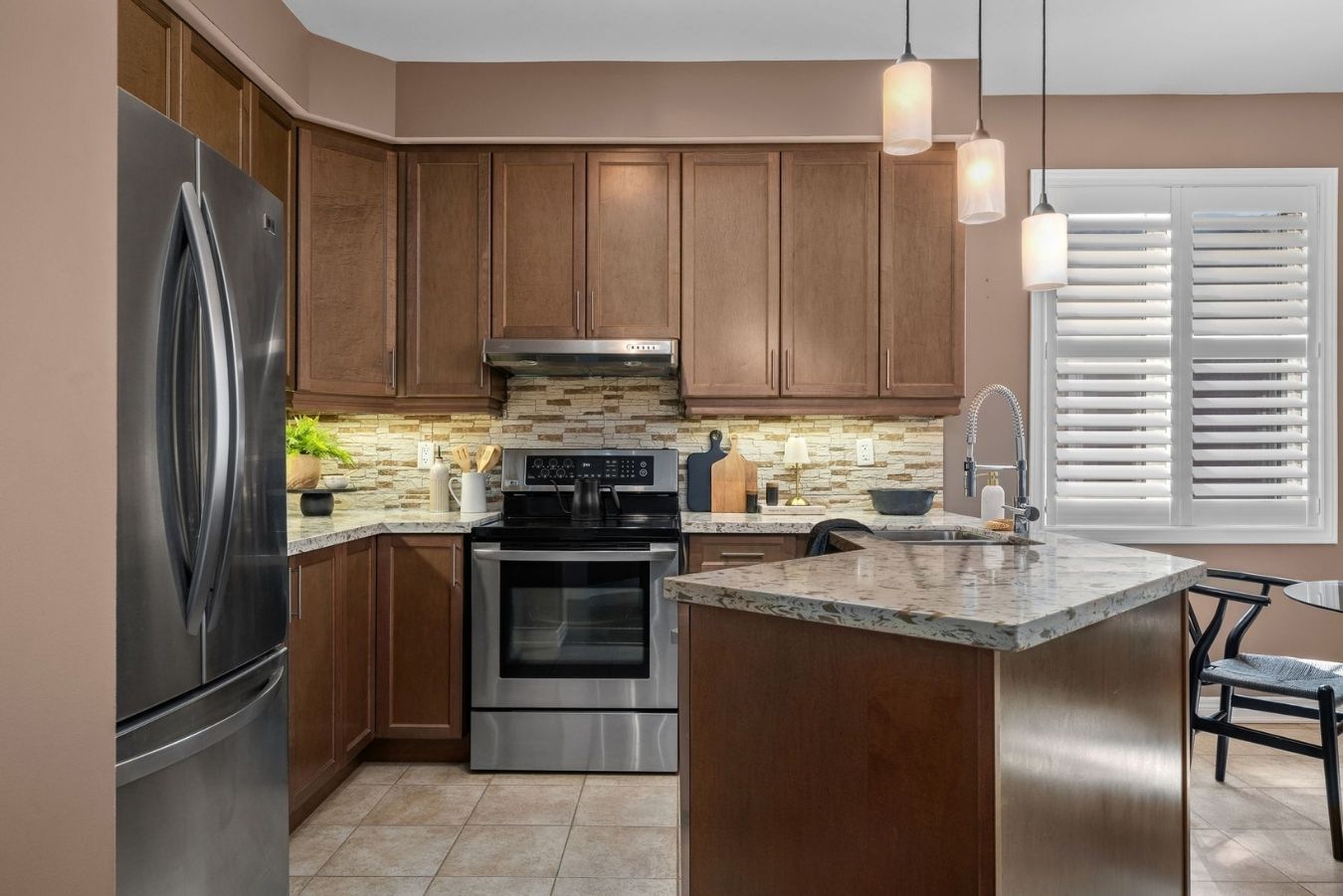 Kitchen at 14 Sleepy Hollow Place, Whitby, with stainless steel appliances and tile flooring