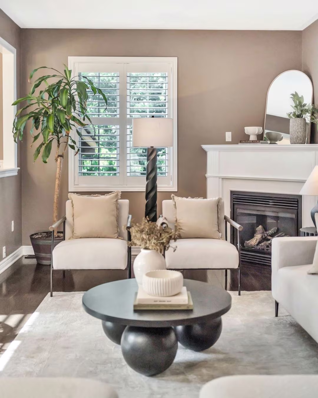 Gas fireplace in the living room at 14 Sleepy Hollow Place, Whitby, flanked by seating