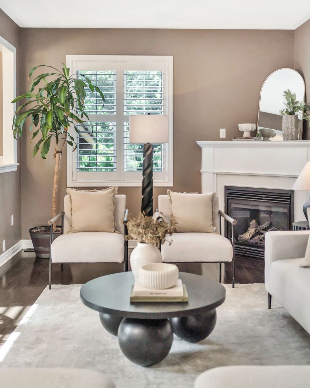 Gas fireplace in the living room at 14 Sleepy Hollow Place, Whitby, flanked by seating