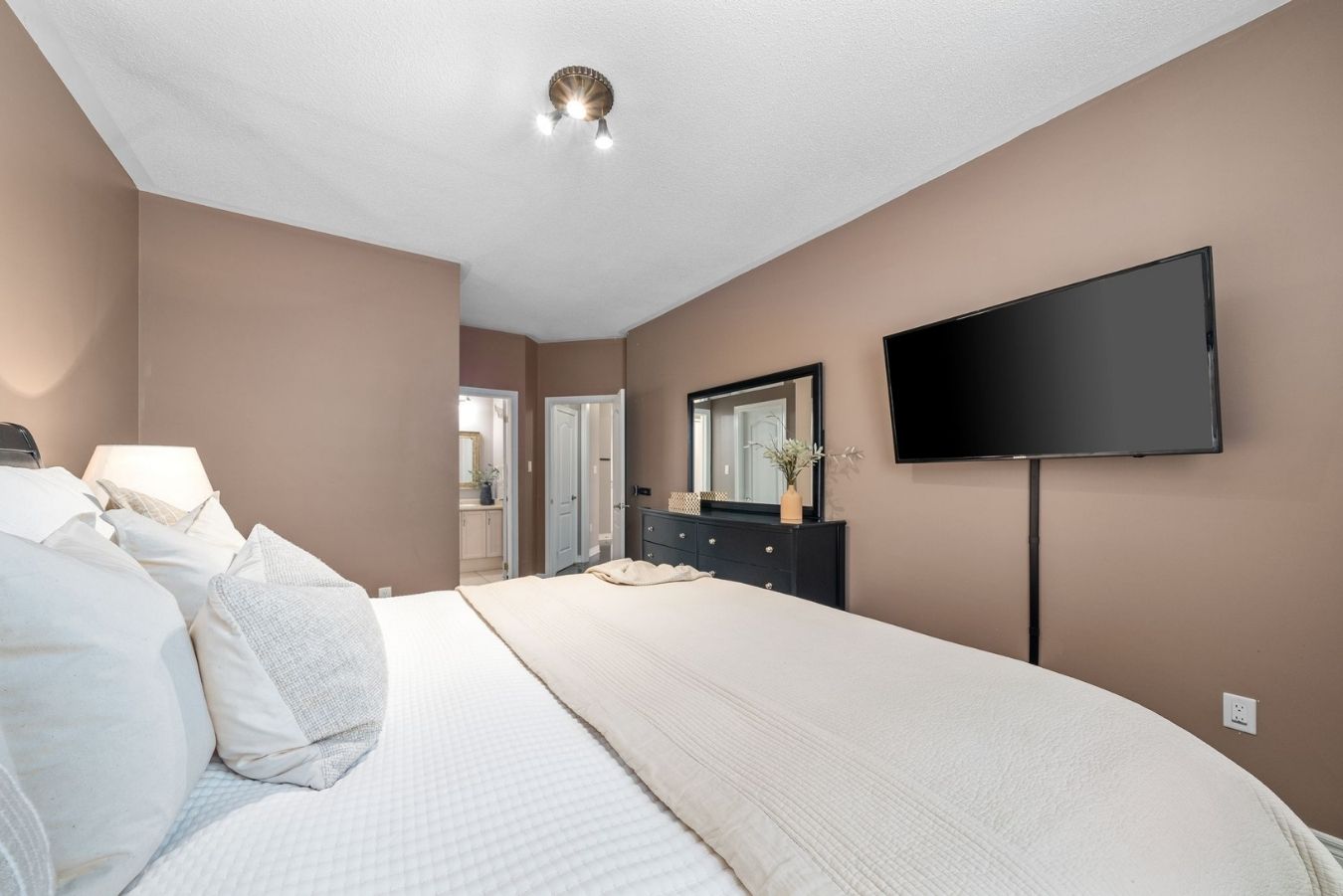 Primary bedroom at 14 Sleepy Hollow Place, Whitby, with hardwood floors and California shutters