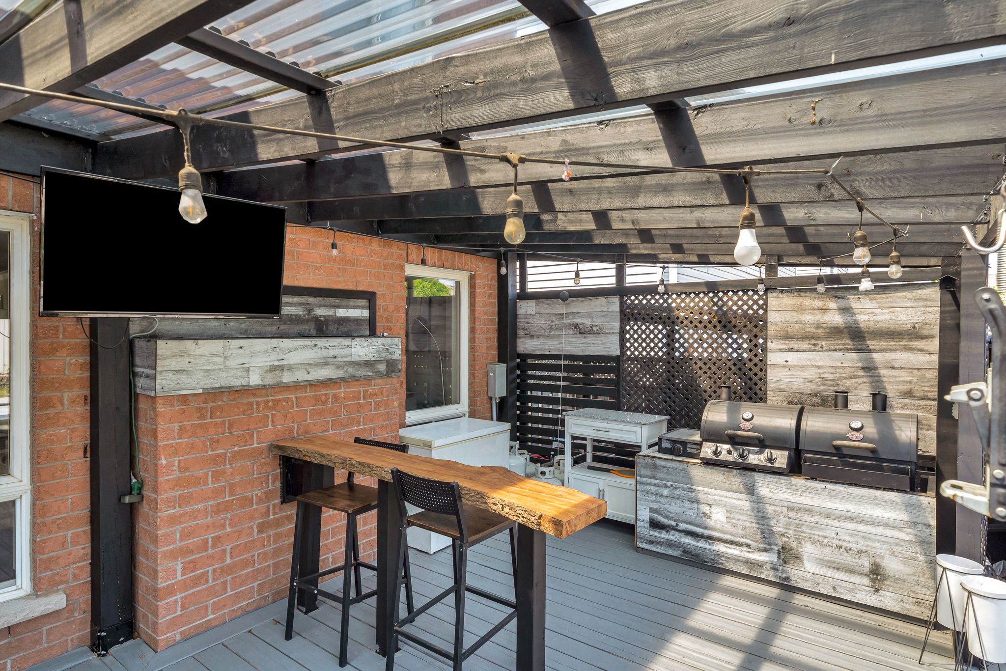 Custom outdoor bar and BBQ station on the covered deck at 1509 Grandview Street North, Oshawa