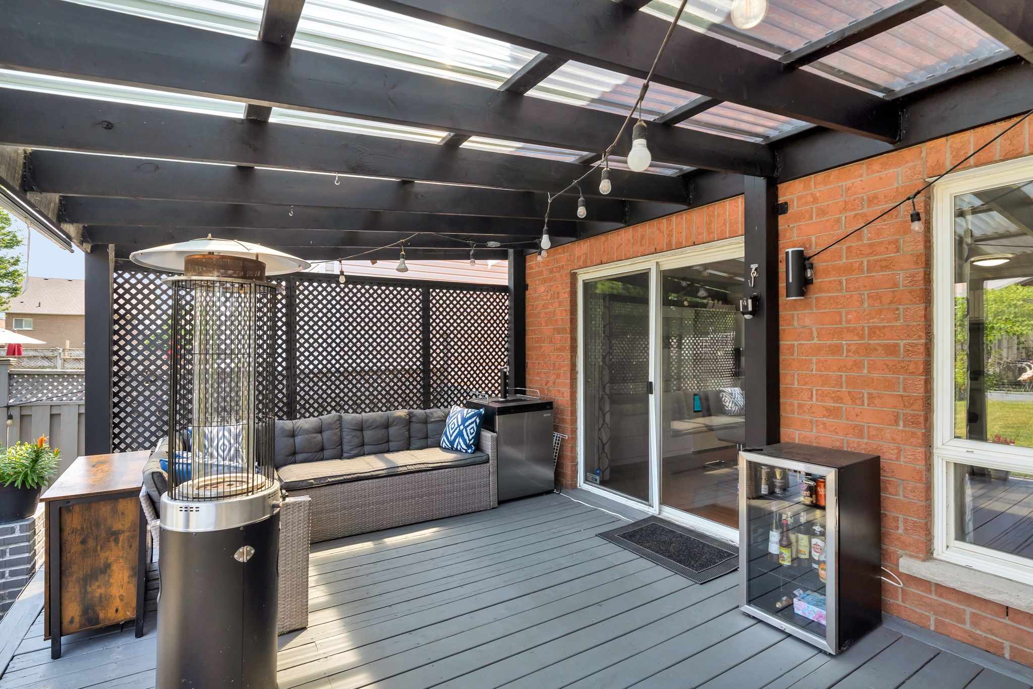 Covered deck at 1509 Grandview Street North, Oshawa, with built-in heaters and lighting