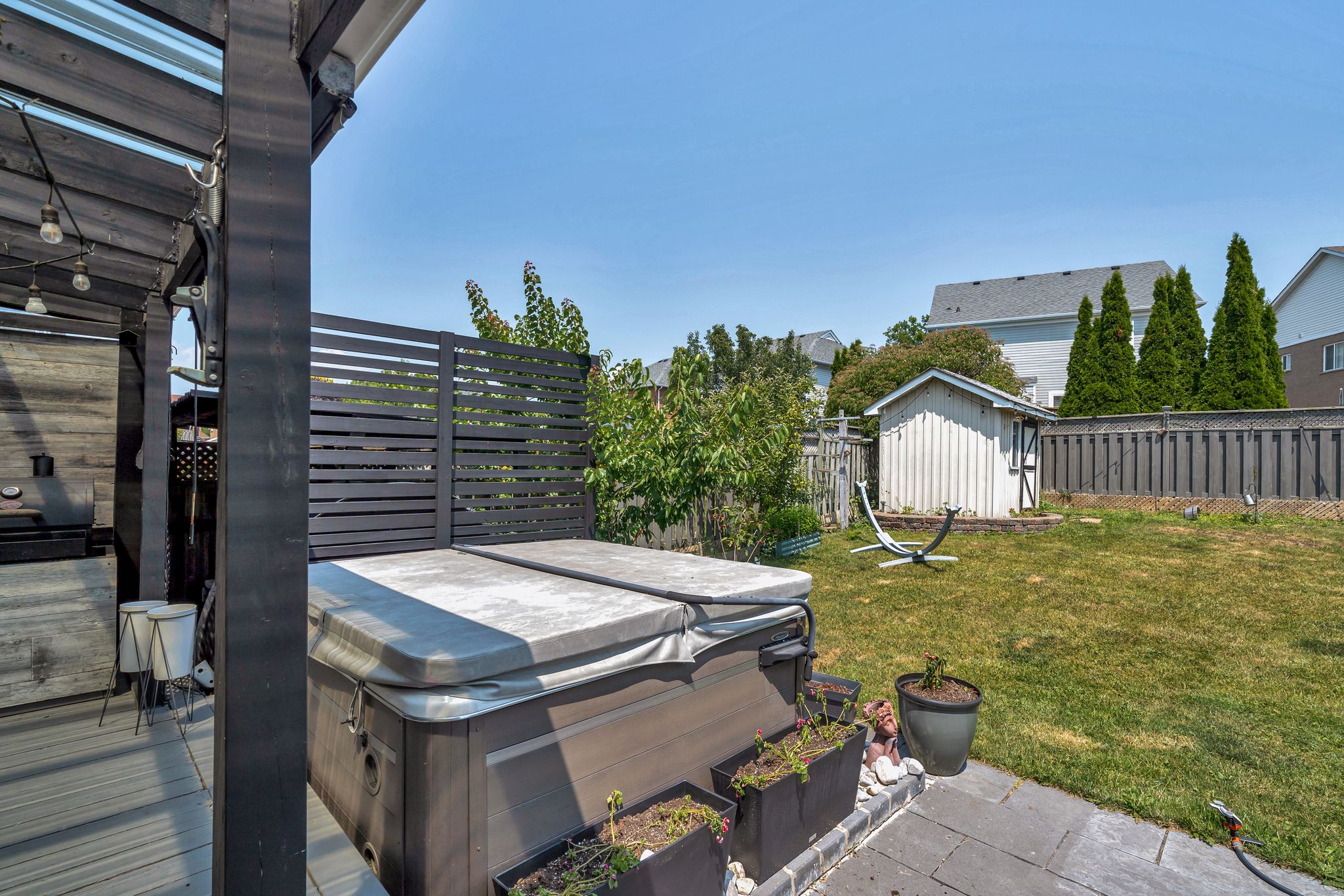 Hot tub in the fenced backyard at 1509 Grandview Street North, Oshawa