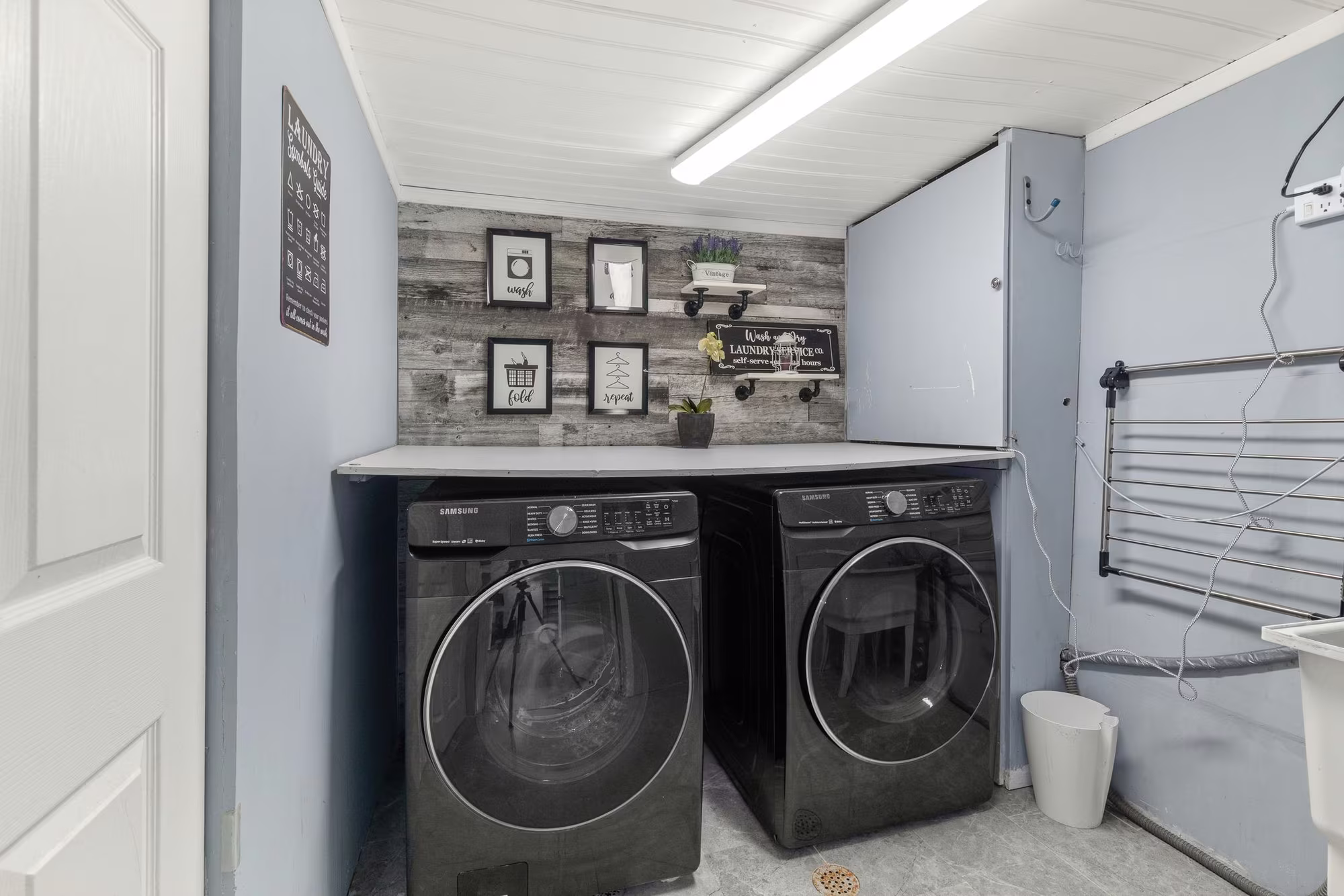 Finished laundry space in the basement at 1509 Grandview Street North, Oshawa, with a folding station