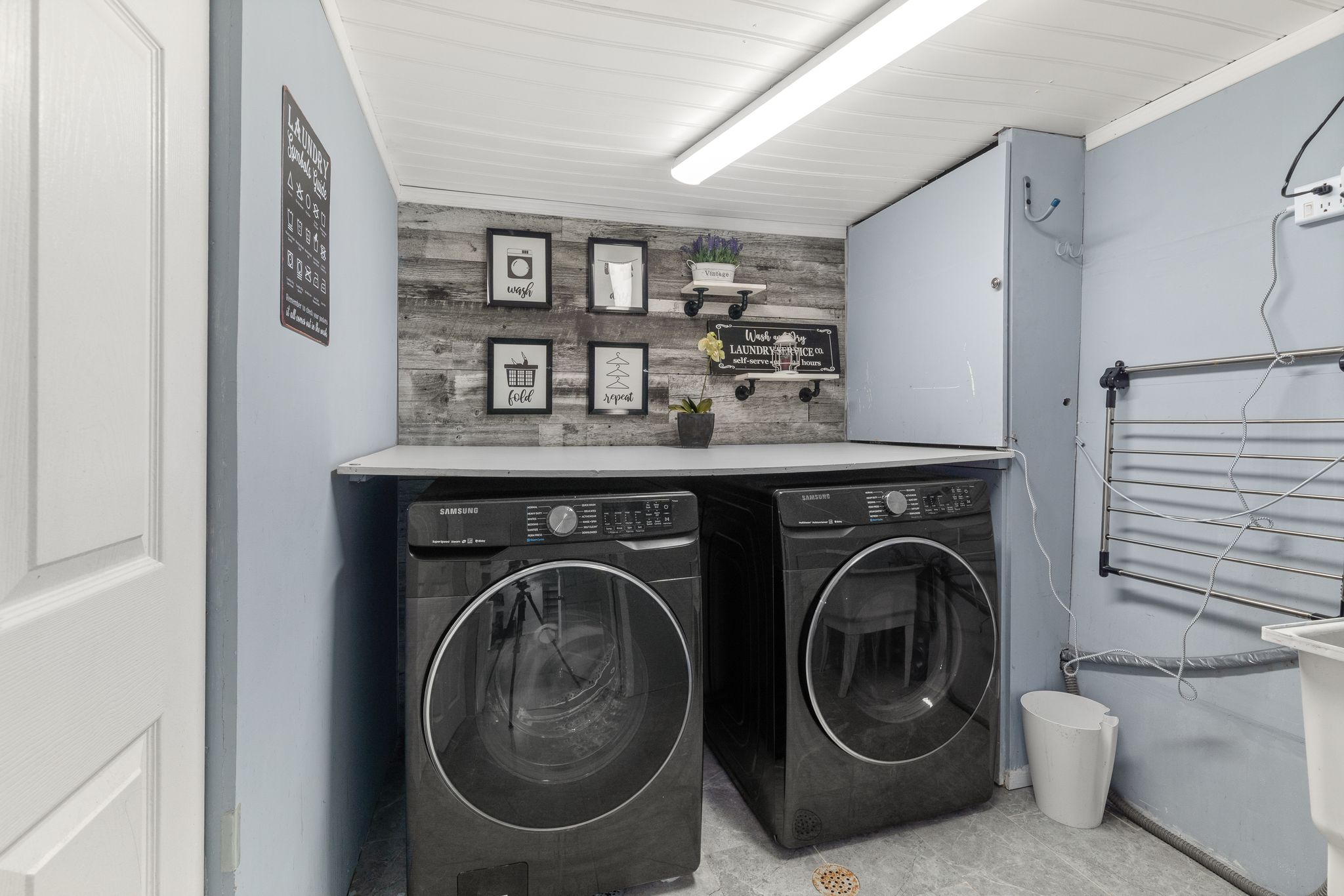 Finished laundry space in the basement at 1509 Grandview Street North, Oshawa, with a folding station