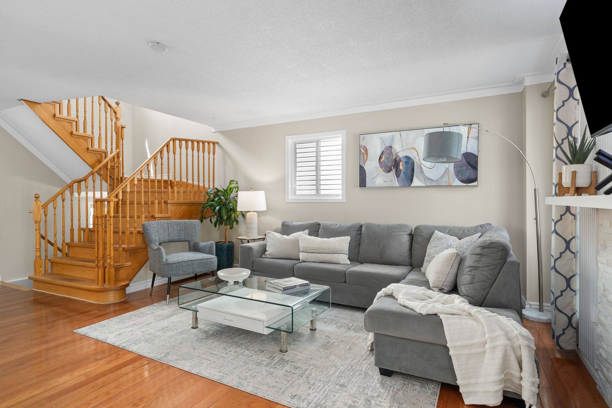 Living room at 1509 Grandview Street North, Oshawa, with a gas fireplace and mounted television