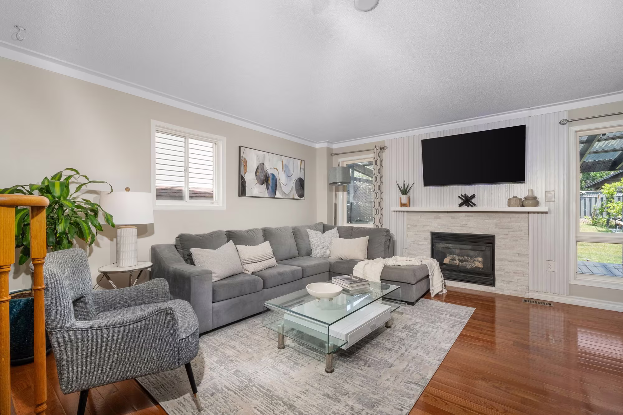 Living room at 1509 Grandview Street North, Oshawa, with hardwood floors and a view to the staircase