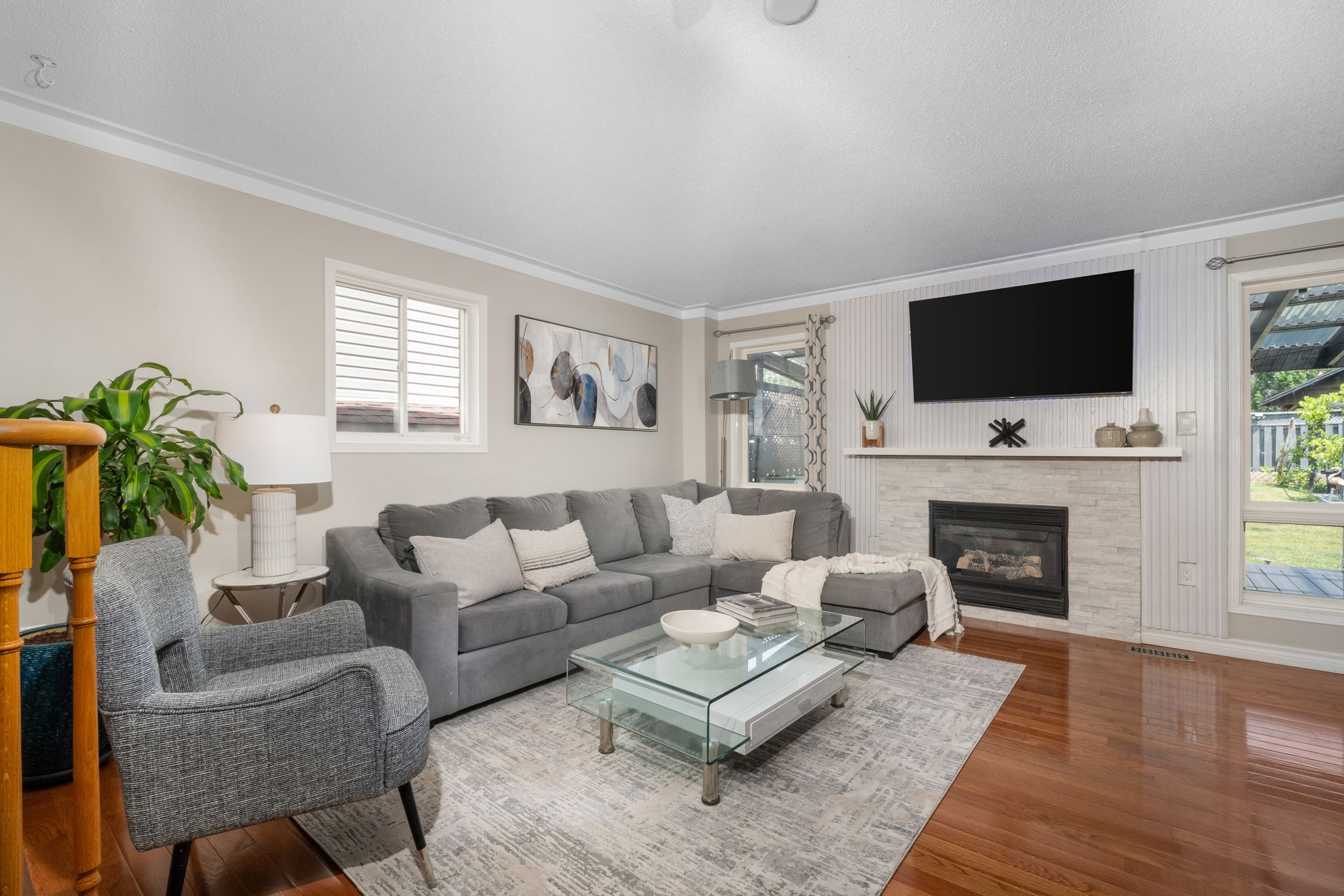 Living room at 1509 Grandview Street North, Oshawa, with hardwood floors and a view to the staircase