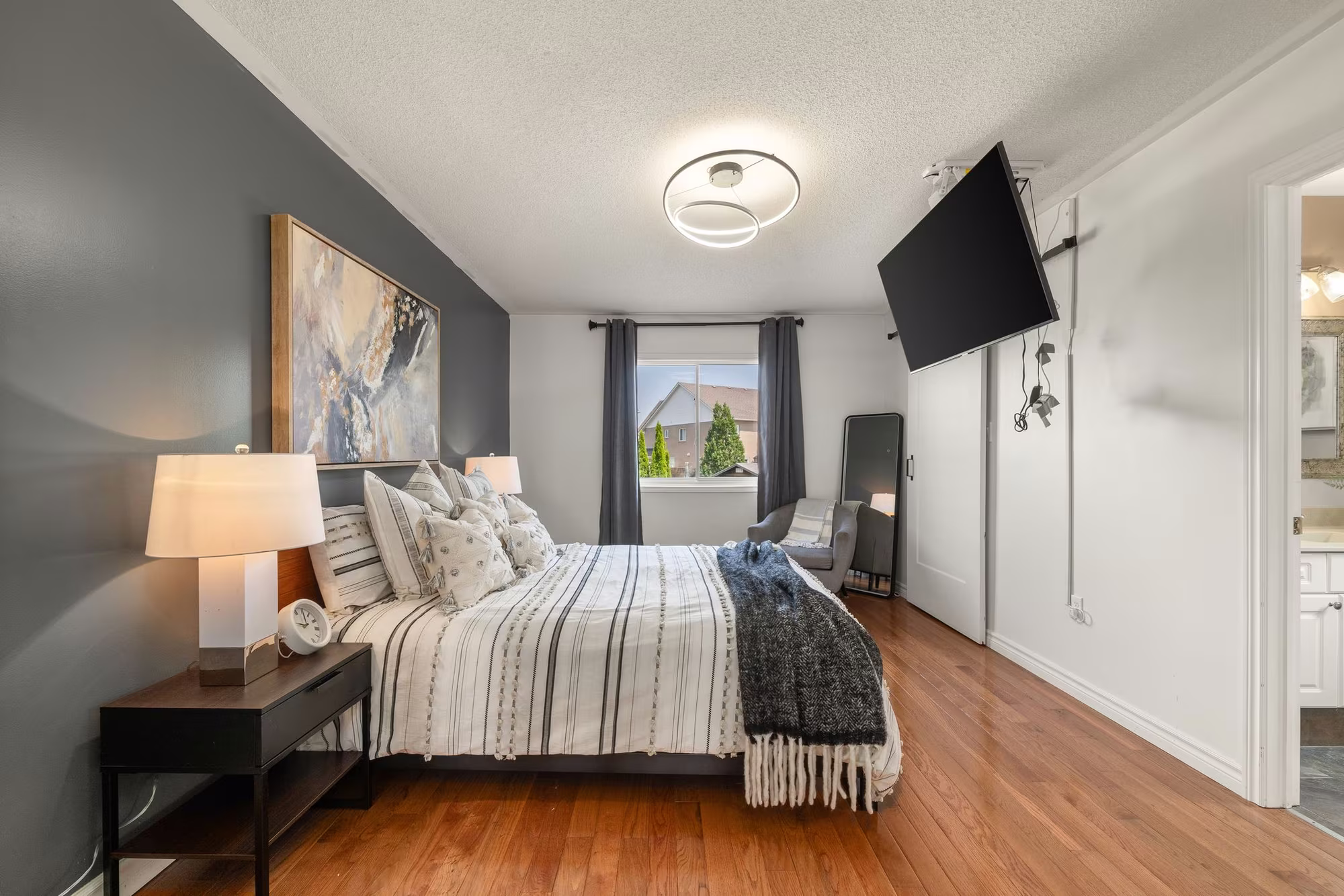 Primary bedroom at 1509 Grandview Street North, Oshawa, with hardwood floors and neutral tones