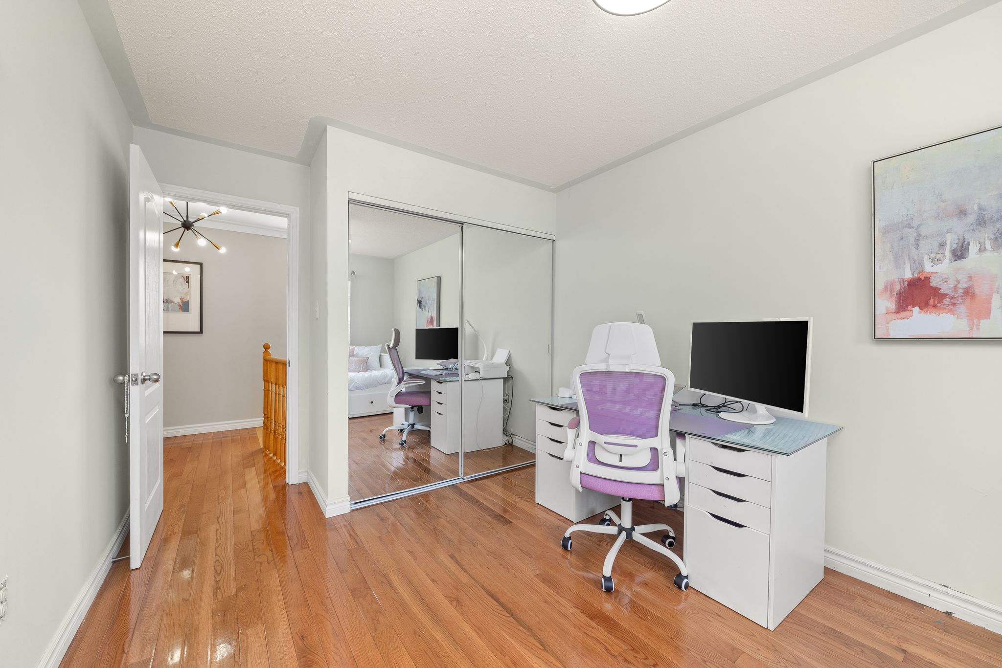 Third bedroom at 1509 Grandview Street North, Oshawa, set up as a home office with a mirrored closet