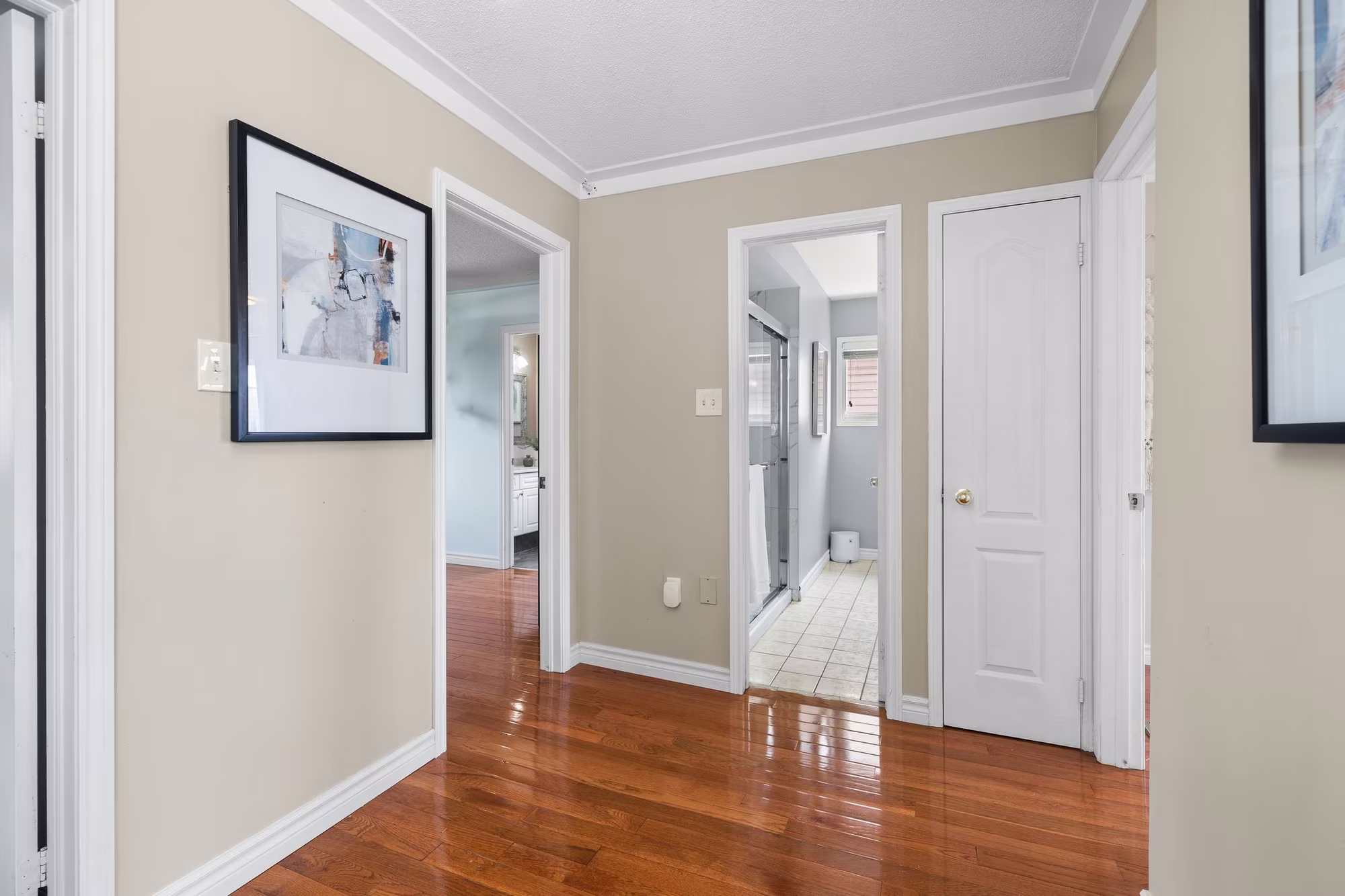 Upper hallway at 1509 Grandview Street North, Oshawa, with hardwood floors and updated lighting