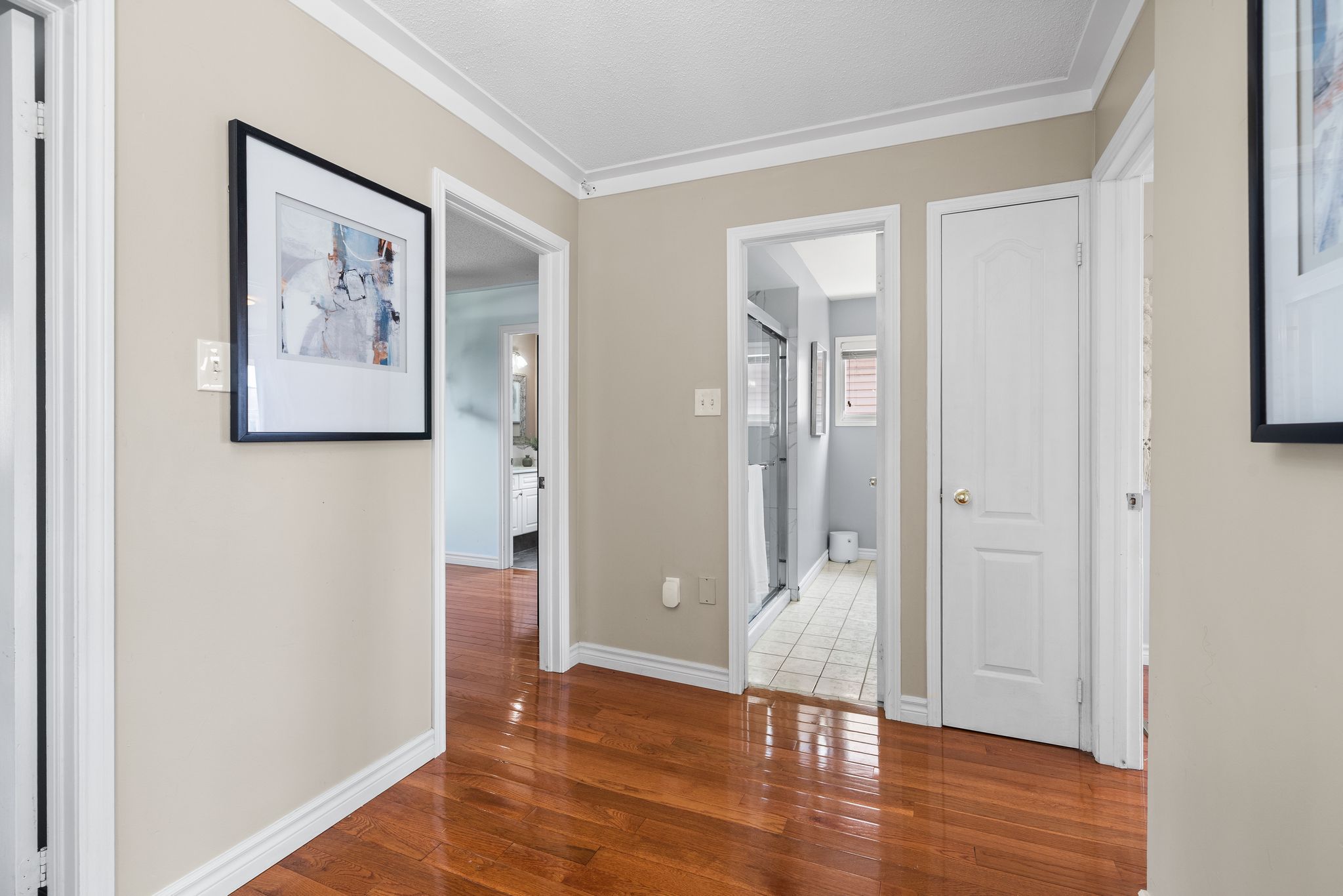 Upper hallway at 1509 Grandview Street North, Oshawa, with hardwood floors and updated lighting