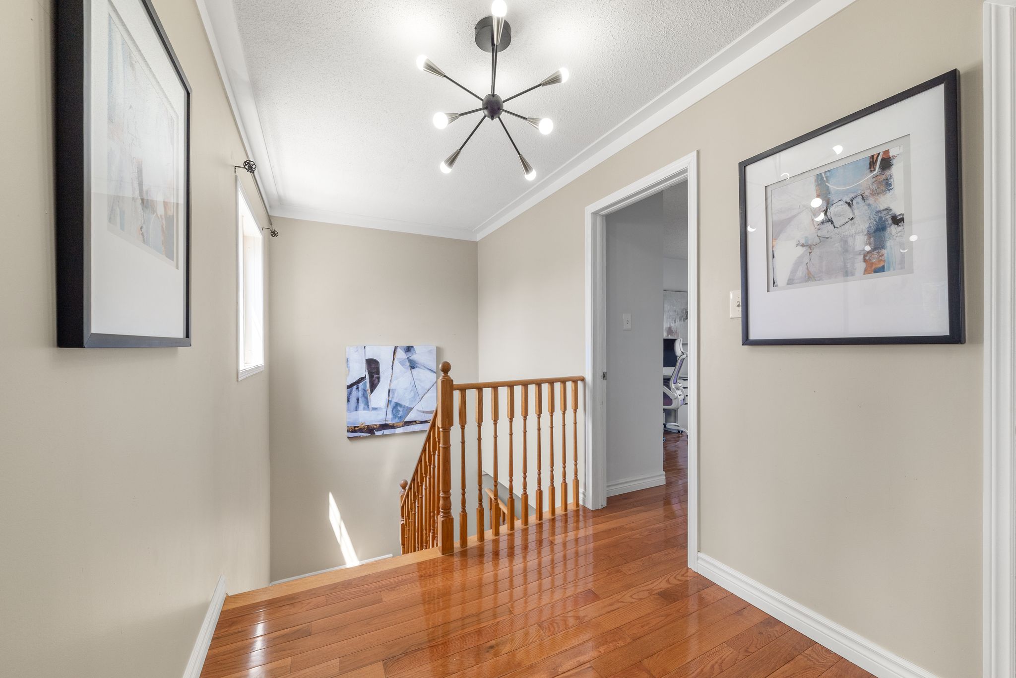 Upper landing at 1509 Grandview Street North, Oshawa, with hardwood floors and a wide layout