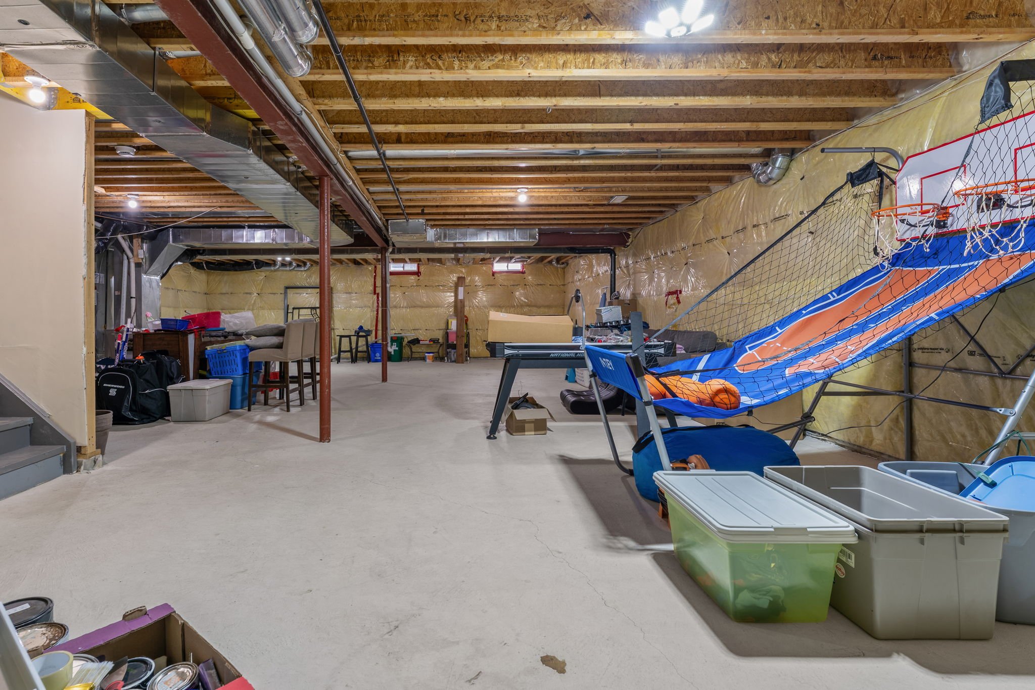 Unfinished basement at 1683 Finkle Drive, Oshawa, with support posts and rough-in mechanicals visible