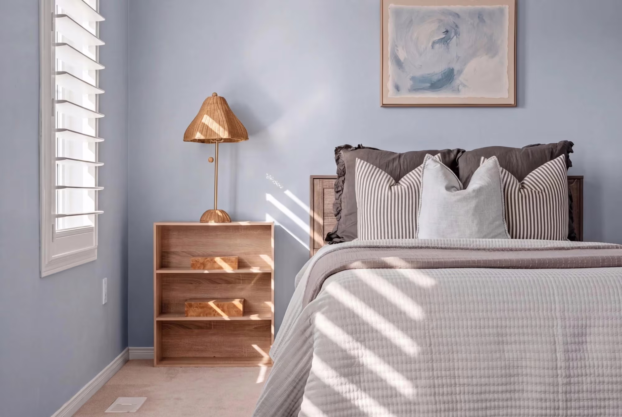 Third bedroom at 1683 Finkle Drive, Oshawa, with an open bookshelf nightstand and woven table lamp
