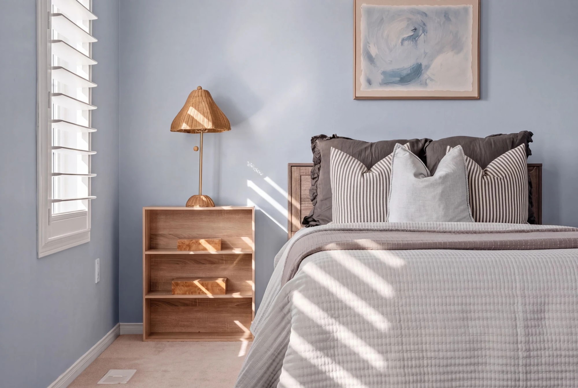 Third bedroom at 1683 Finkle Drive, Oshawa, with an open bookshelf nightstand and woven table lamp
