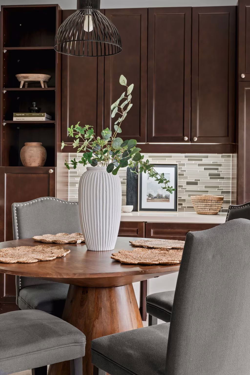 Breakfast area styling detail at 1683 Finkle Drive, Oshawa, with a round wood table and woven placemats