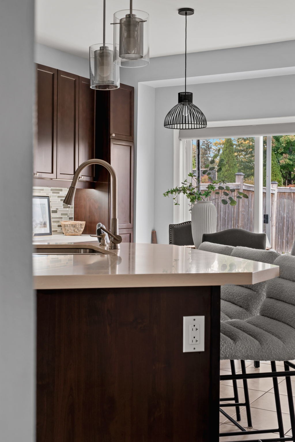 Kitchen island view at 1683 Finkle Drive, Oshawa, with pendant lighting and a view into the breakfast area