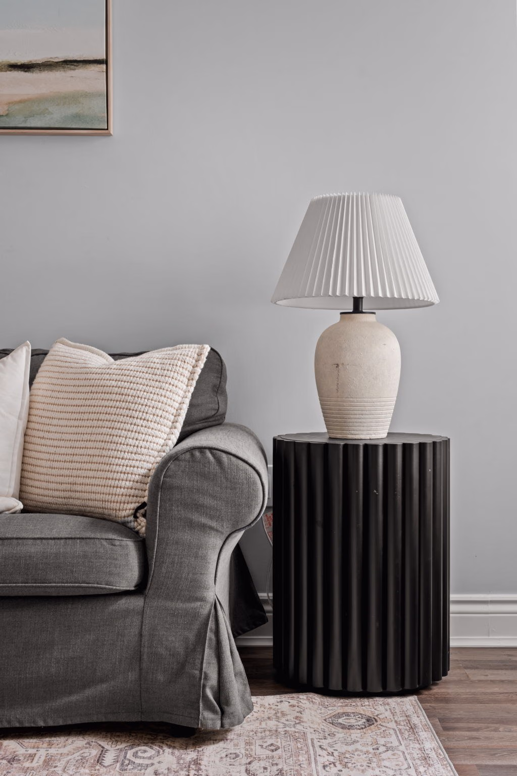 Living room side table styling detail at 1683 Finkle Drive, Oshawa, with a fluted accent table and ceramic lamp