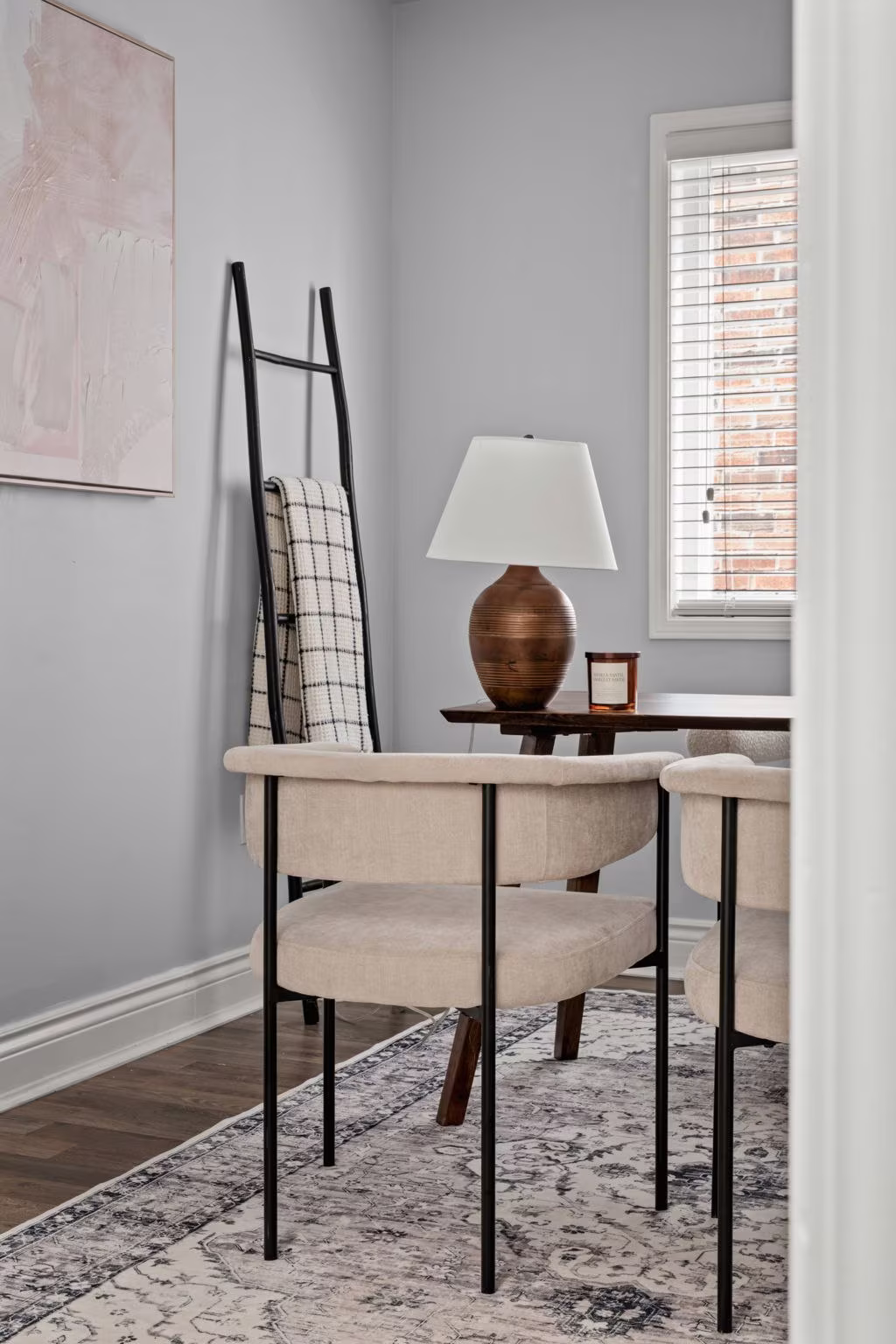 Office styling detail at 1683 Finkle Drive, Oshawa, with a blanket ladder, ceramic lamp and accent chairs